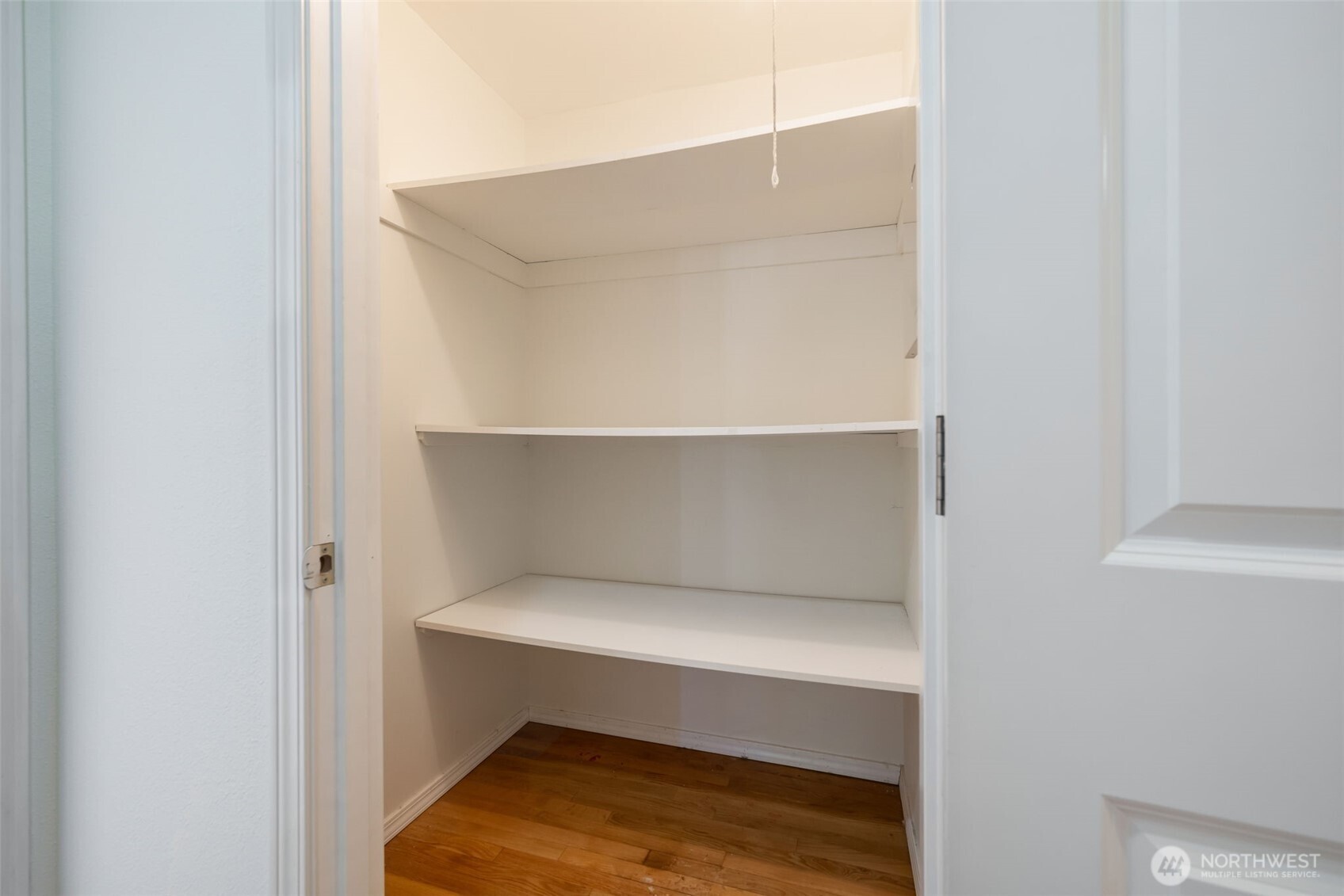 Oversized linen closet in the hallway.