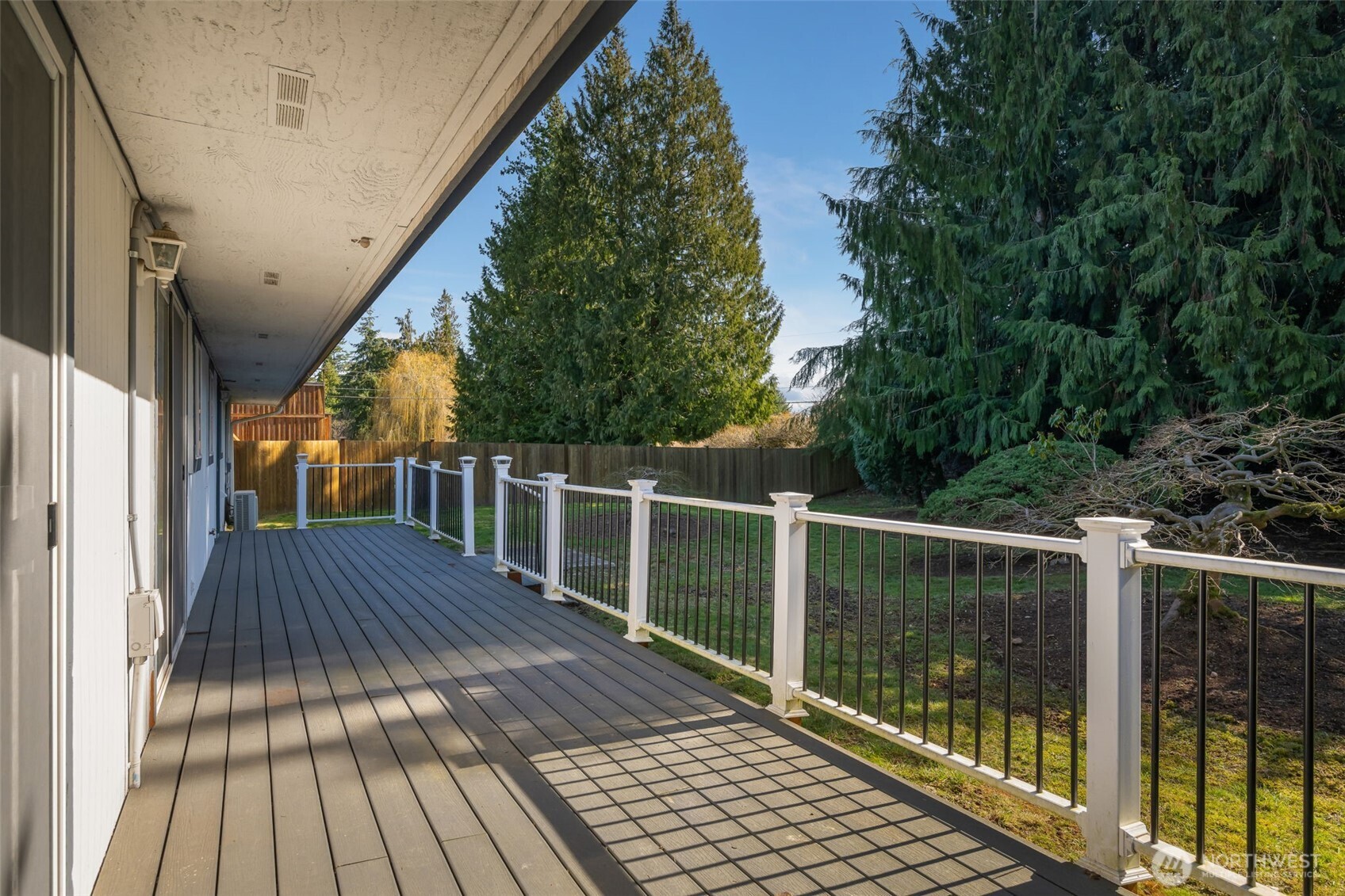 South facing back deck overlooks the back yard.