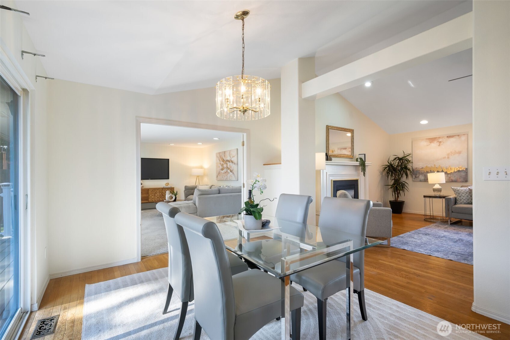 A dining room connects the living room, family room, and kitchen, with bright south facing sliding doors leading to the back deck and yard