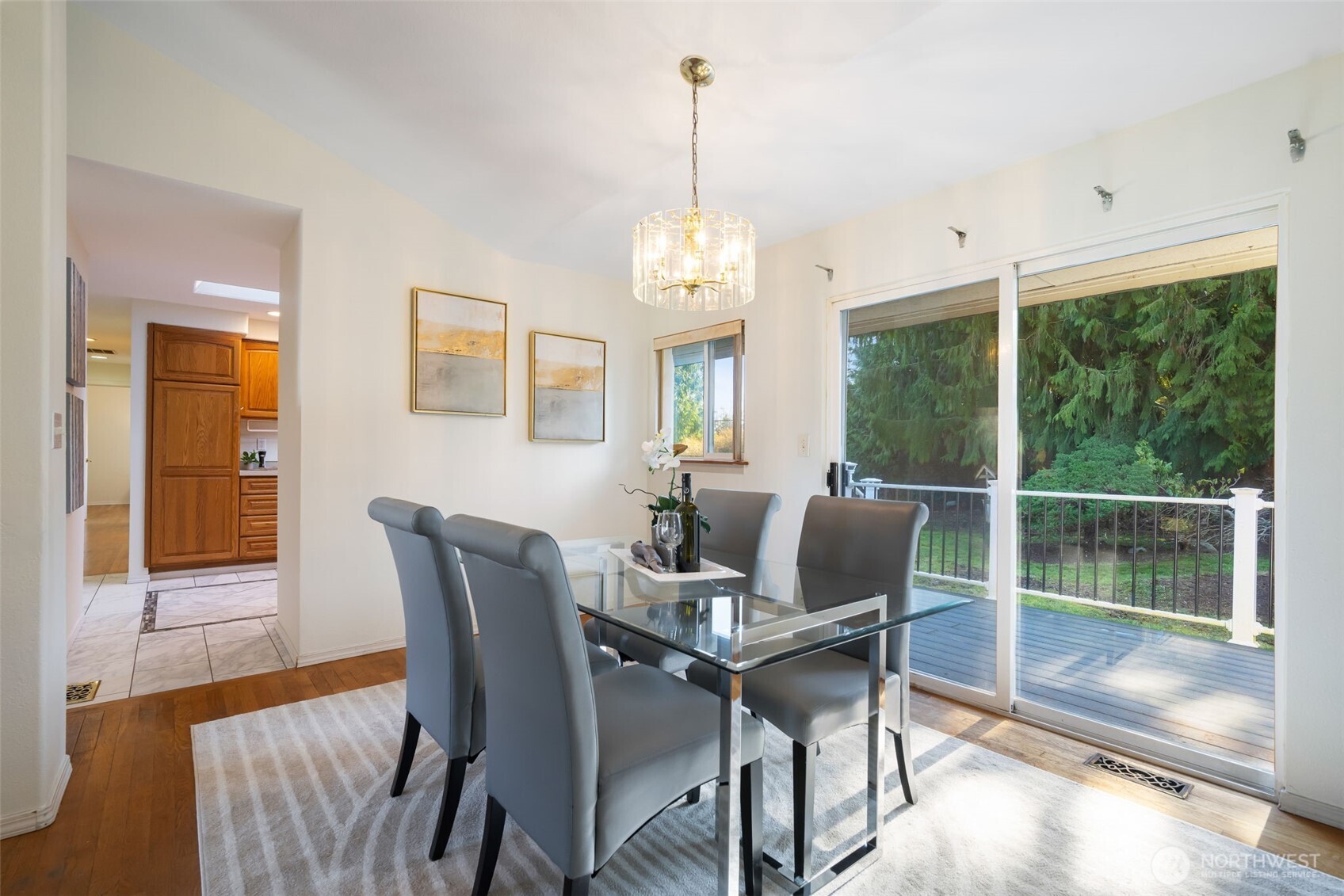 A dining room connects the living room, family room, and kitchen, with bright south facing sliding doors leading to the back deck and yard