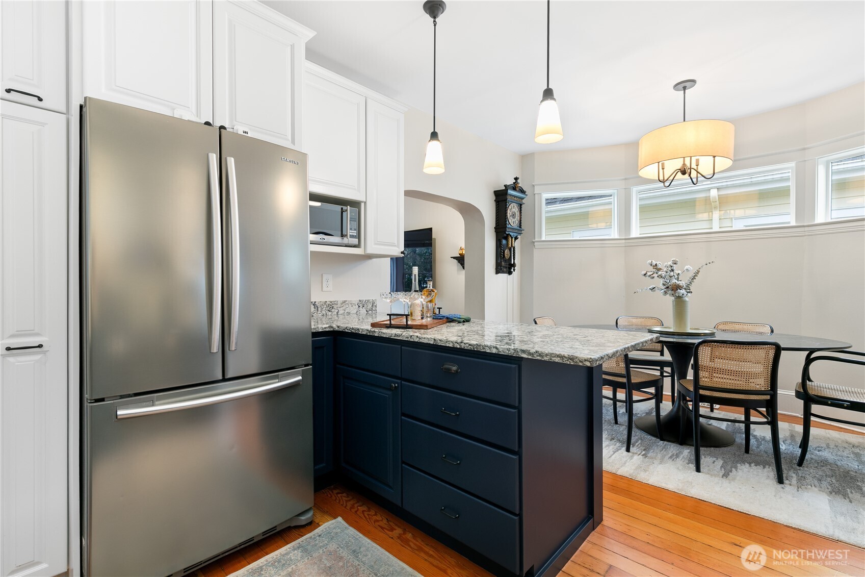 Kitchen island thoughtly separates space and provides addition counterspace.