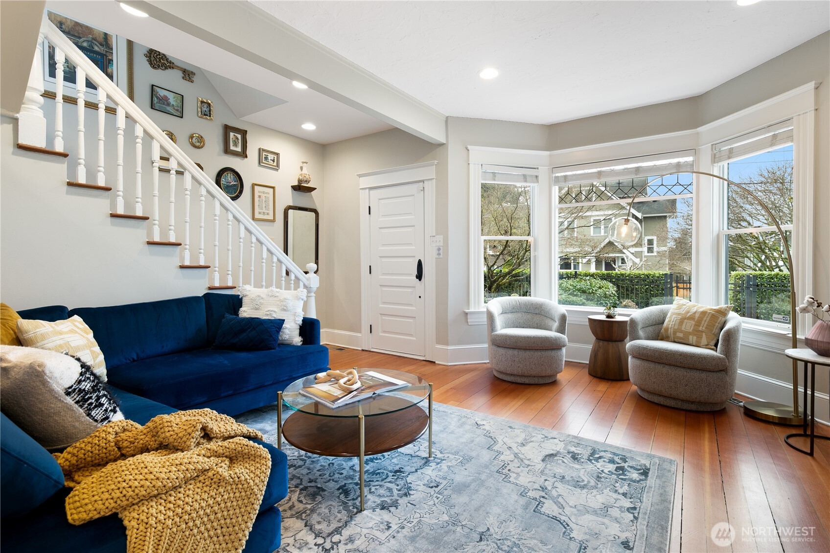 Large windows and recessed lighting highlight the home’s elegant architectural details while maintaining a bright, airy ambiance.