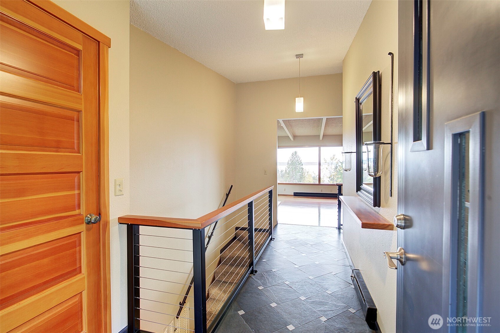 Step inside and immediately catch a glimpse of the views from the inviting entryway