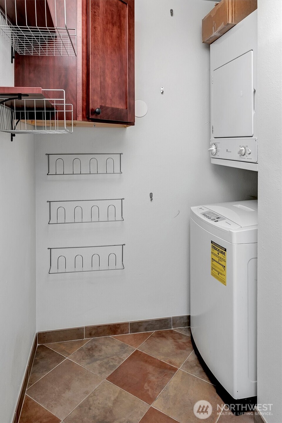In unit laundry with plenty of room for extra storage.