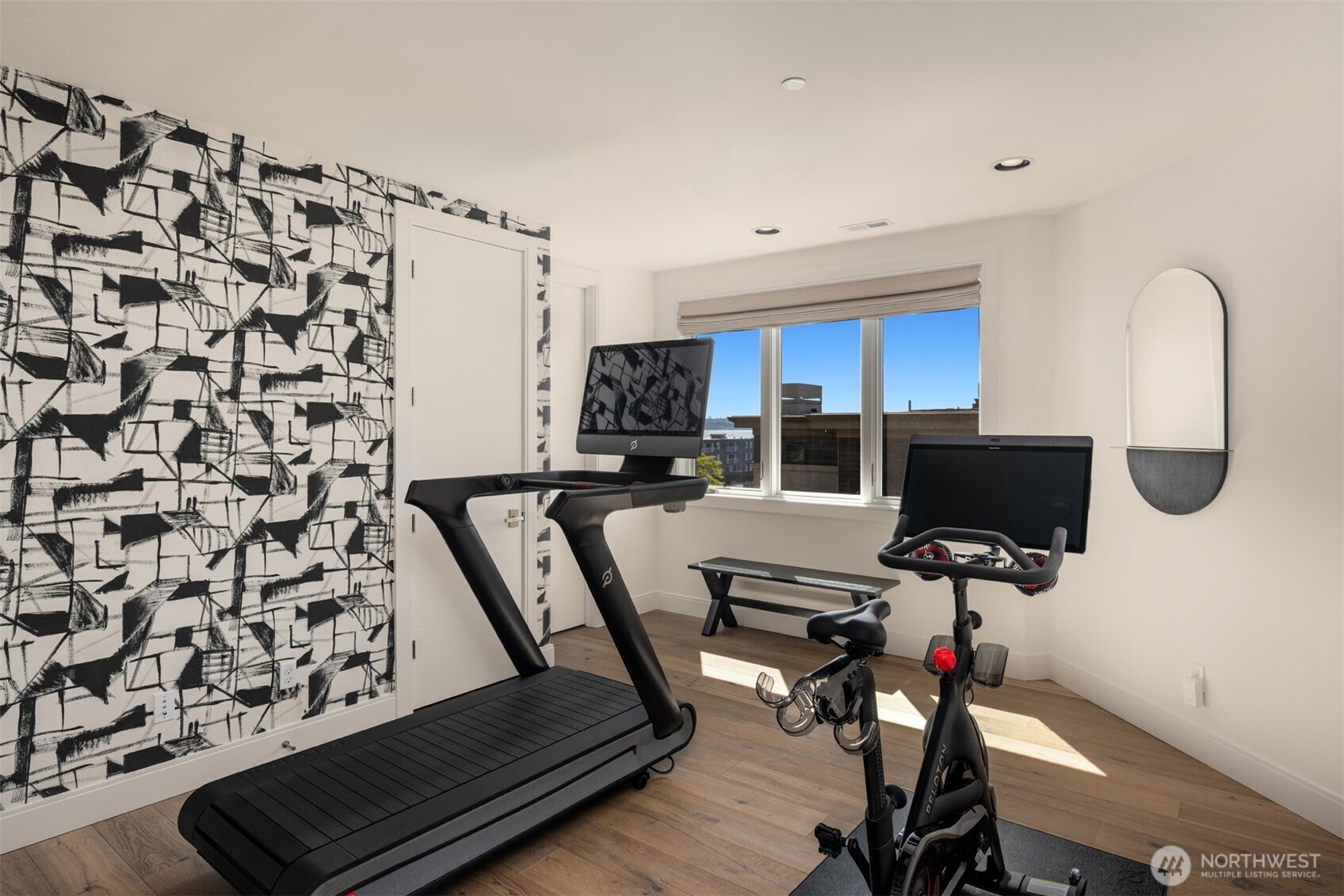 The second en-suite bedroom has been repurposed as a personal work out room.