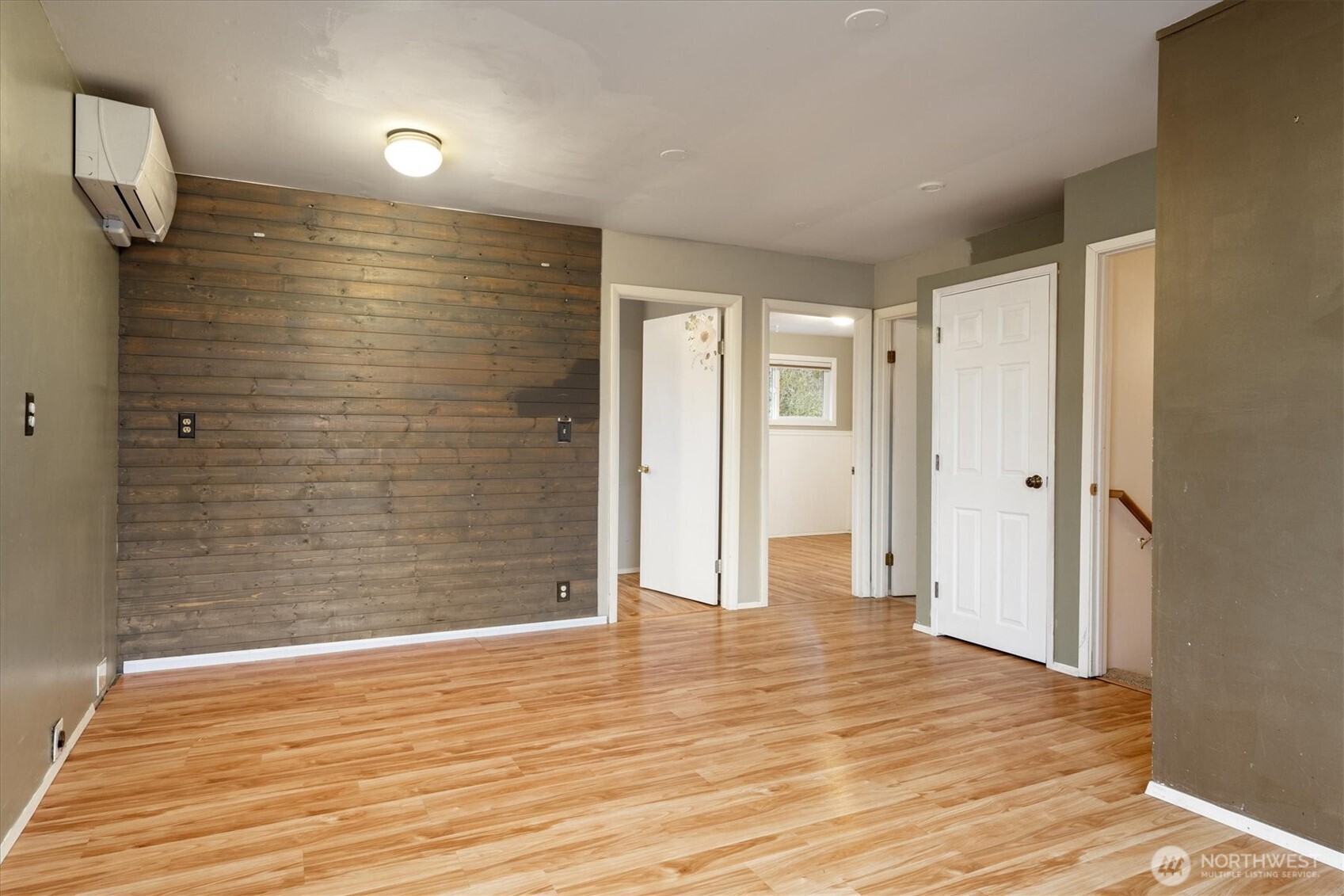 View looking toward two upstairs bedroom and full bath in hallway