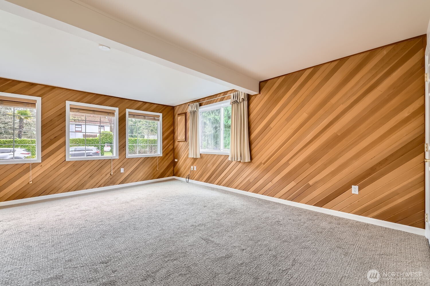 Expansive bedroom in ADU with lots of natural light flooding in.