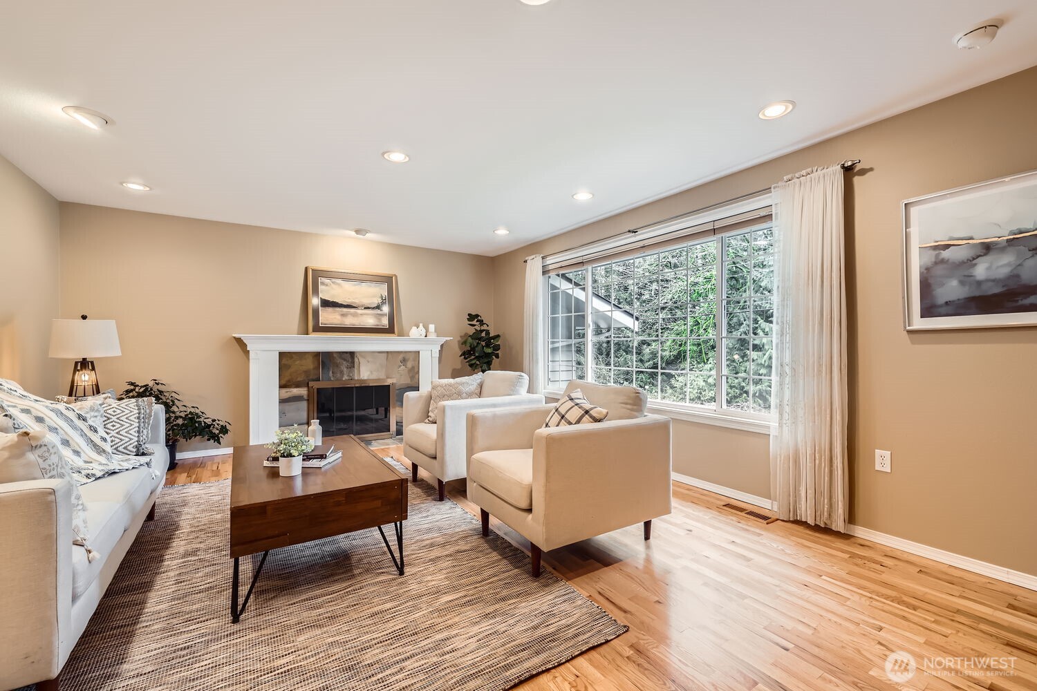 Spacious living room, flooded with lots of natural light.