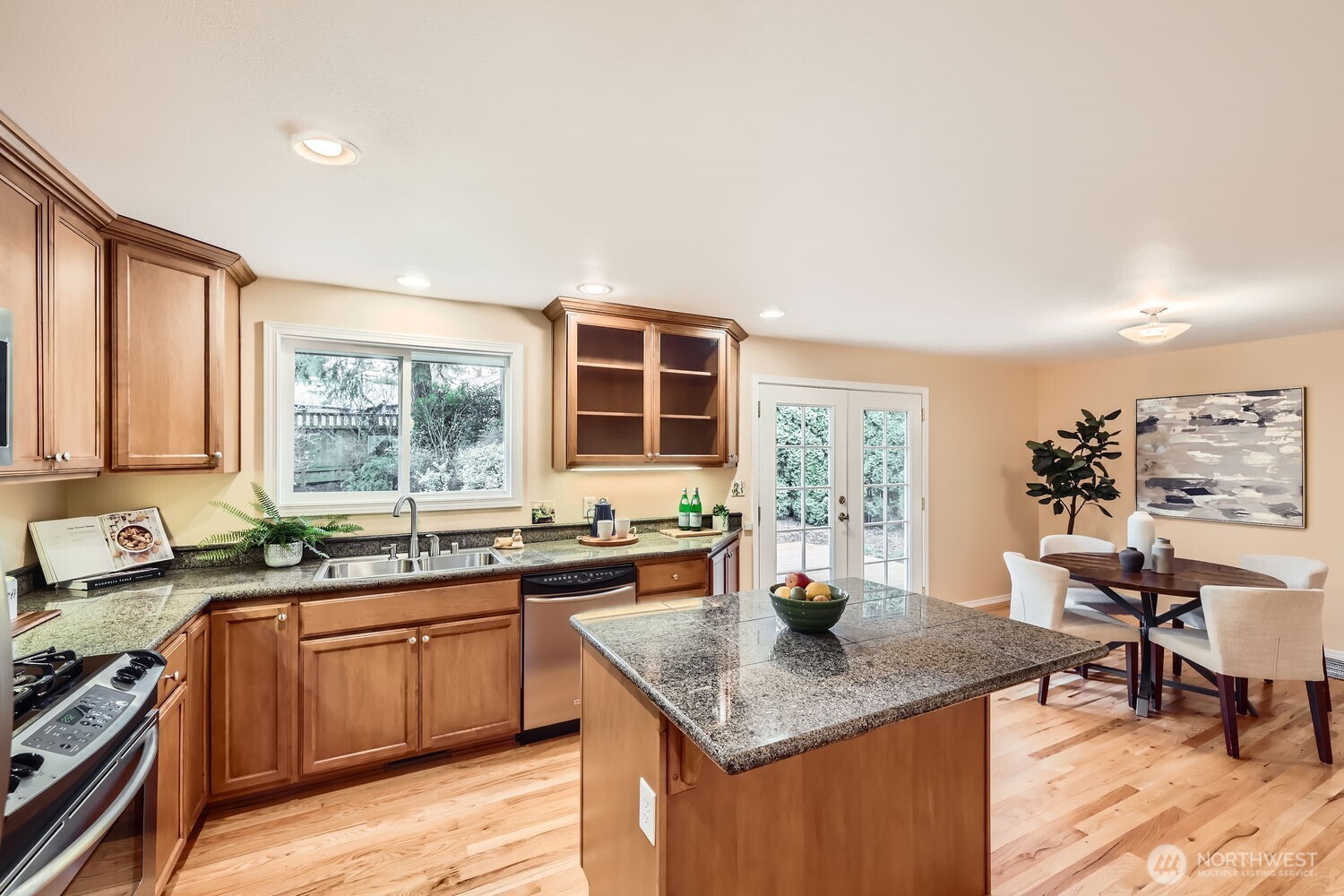 Dining room and kitchen open to deck in backyard - great space for entertaining.