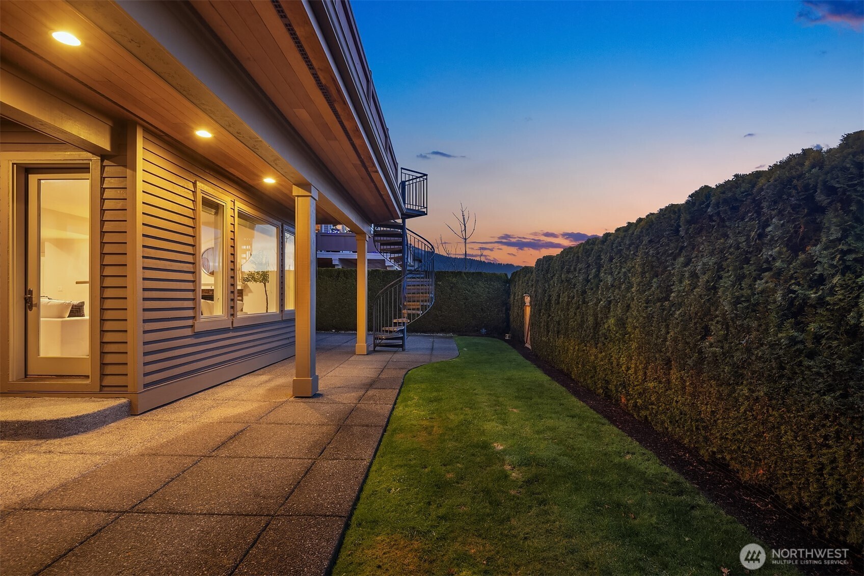 Fully fenced backyard patio.