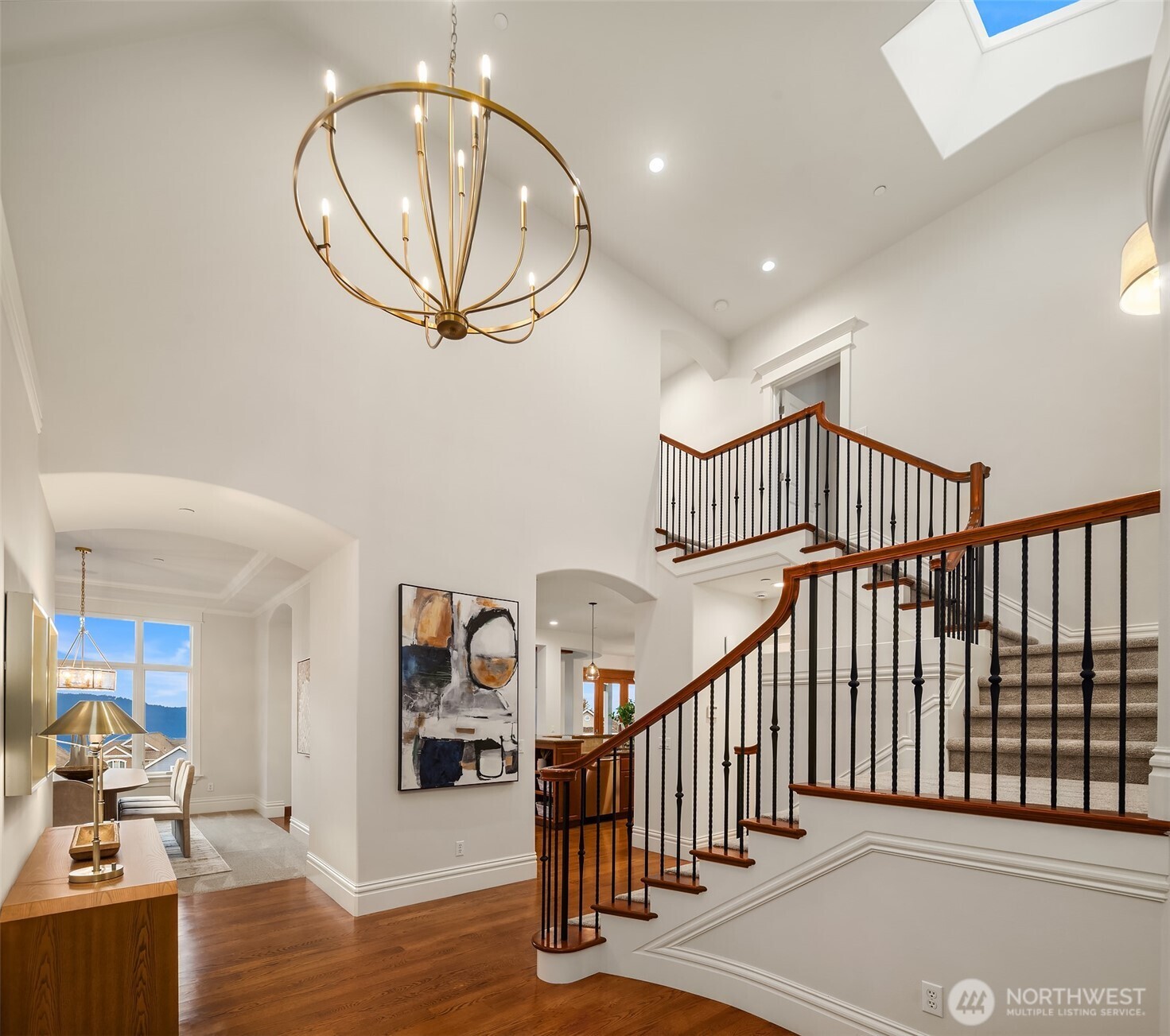 Grand entry showcases the hardwood floors and new designer lighting.