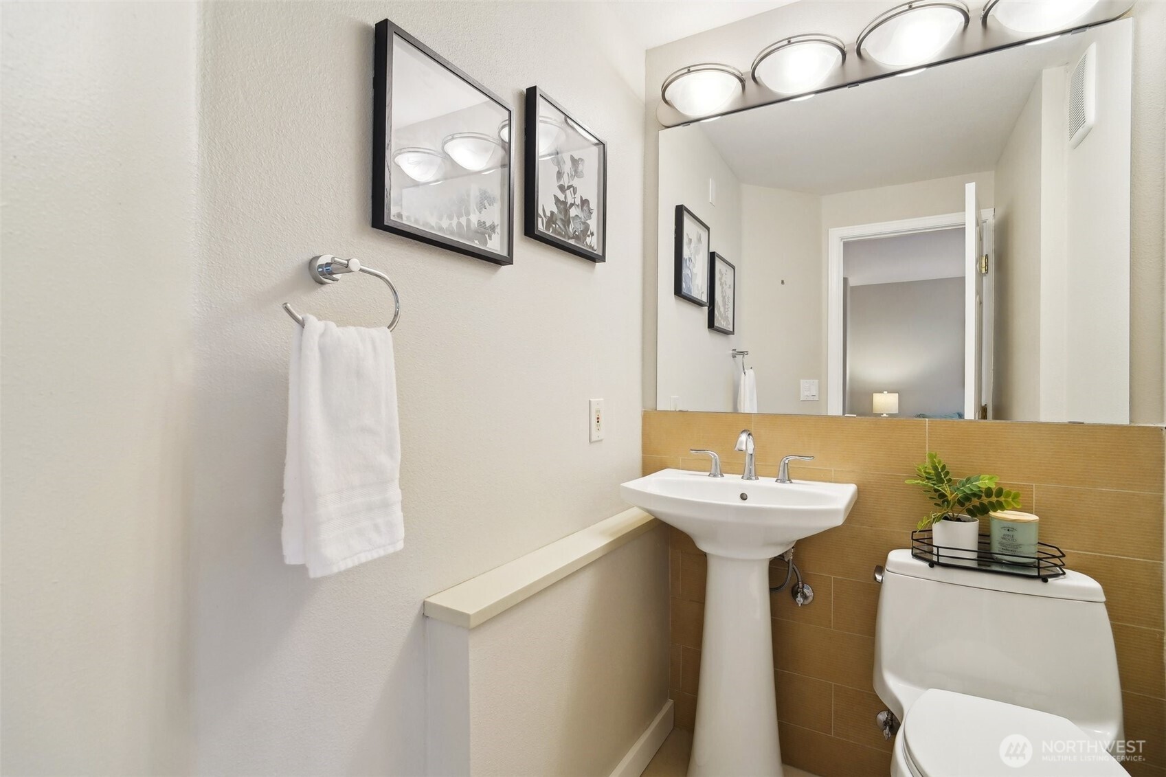 Stylish refreshed half bath on the main level.