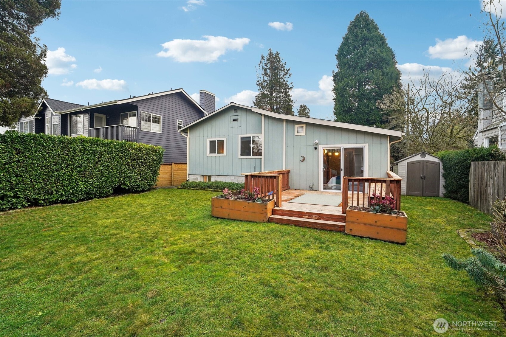 This large deck bathes in sunlight and is ready for summer BBQs and relaxation!