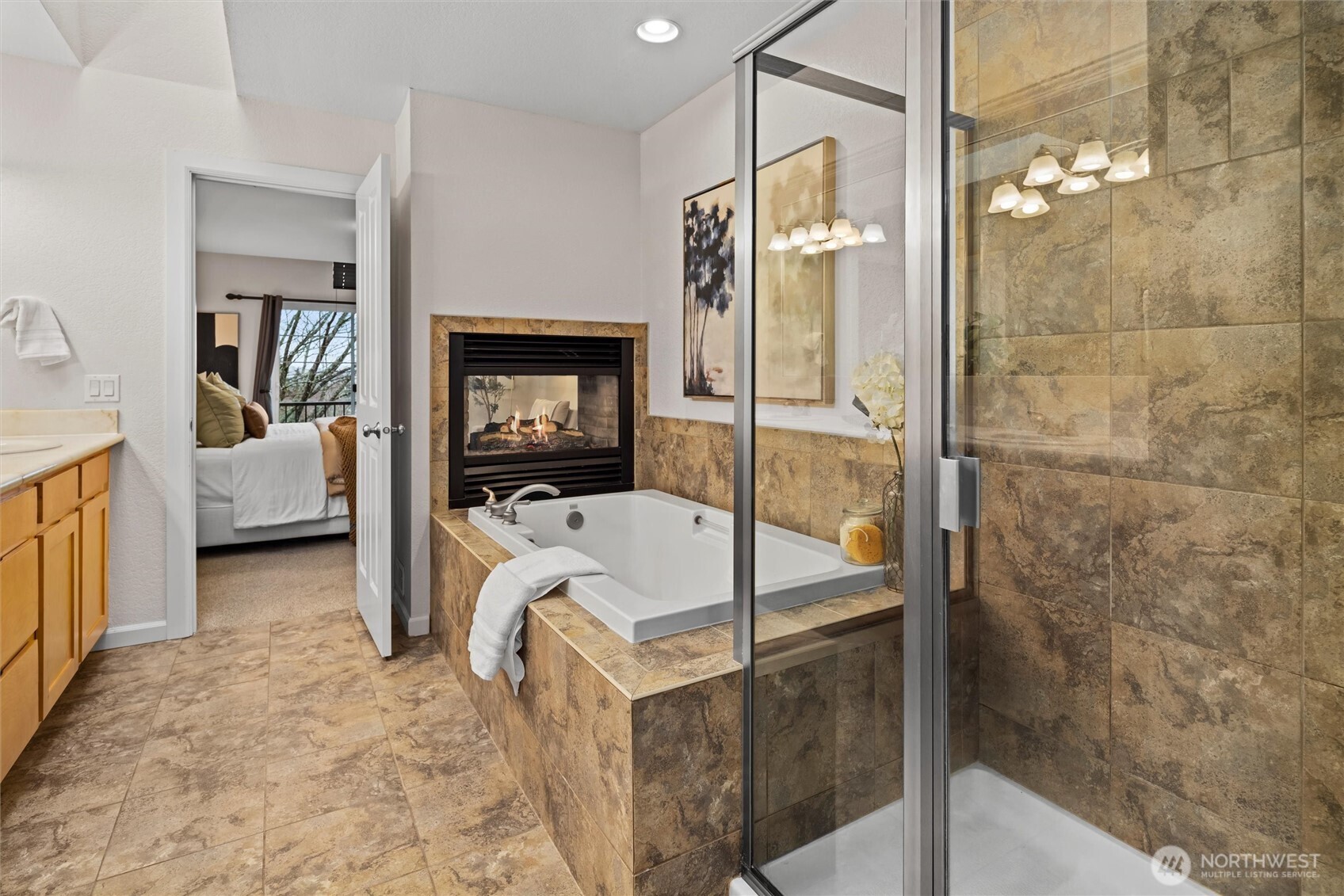 5 piece primary bathroom with relaxing fireplace.