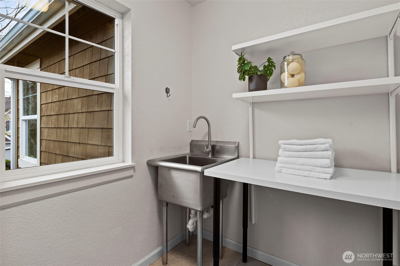 Laundry room with window.