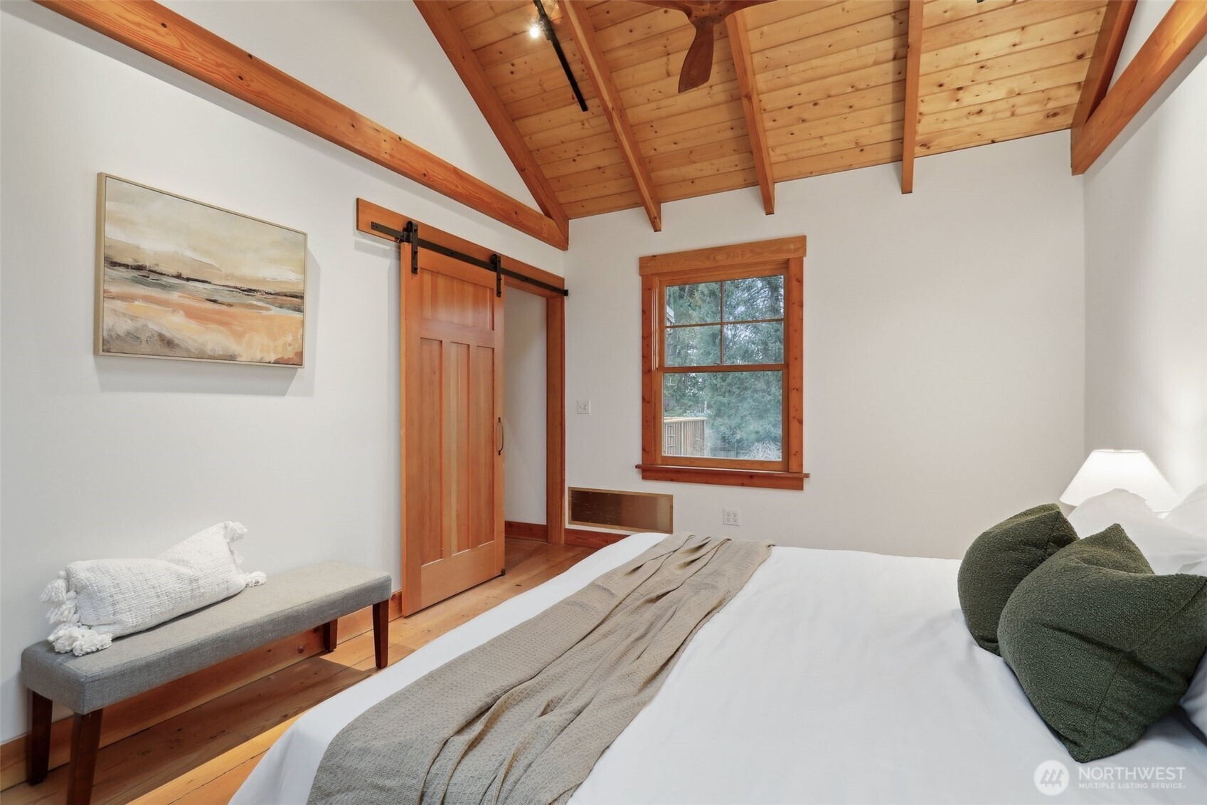 Primary bed also features a customized barn door.