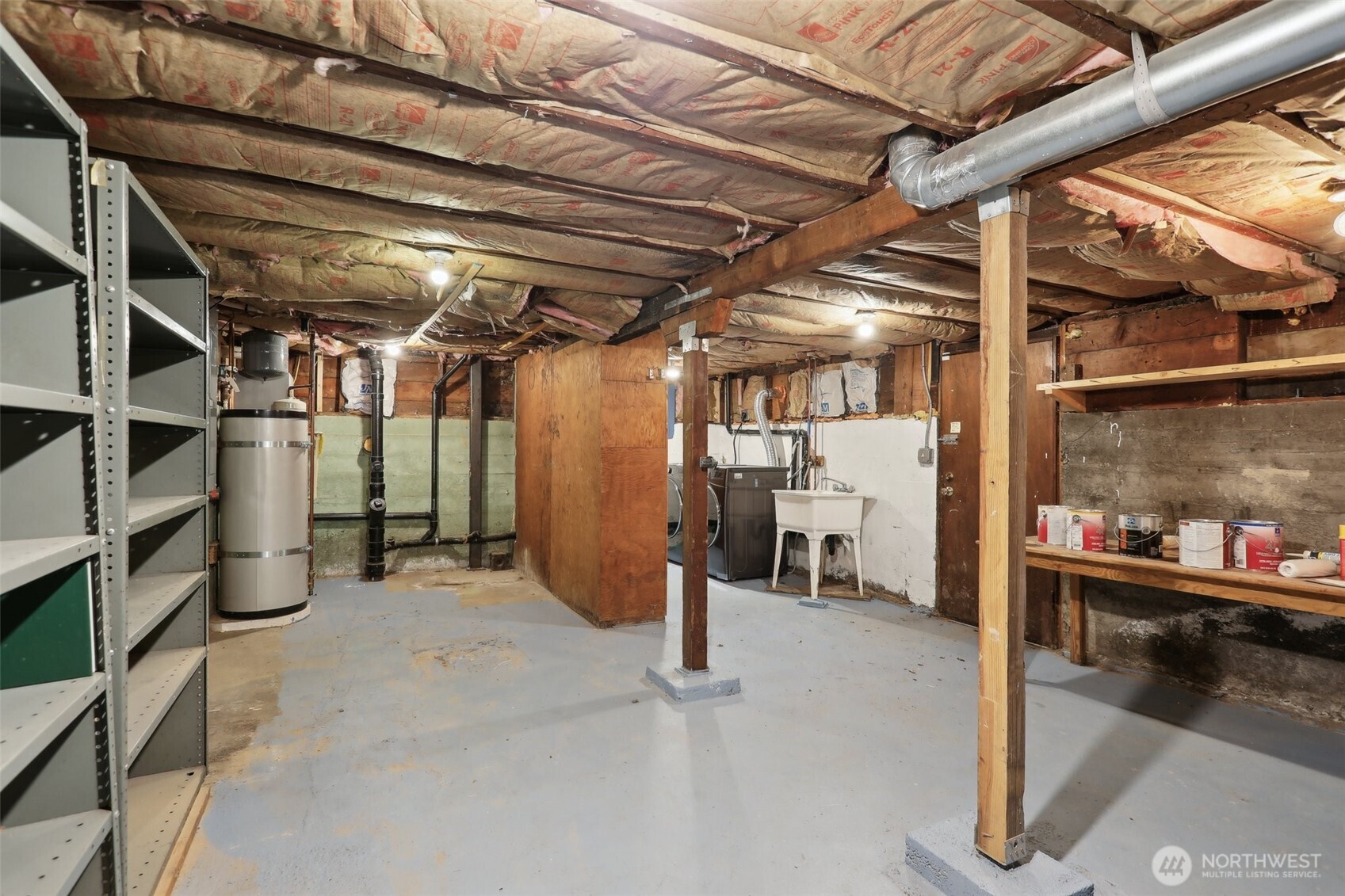 Basement holds washer, dryer, additional storage options, or house a workshop for the creative.