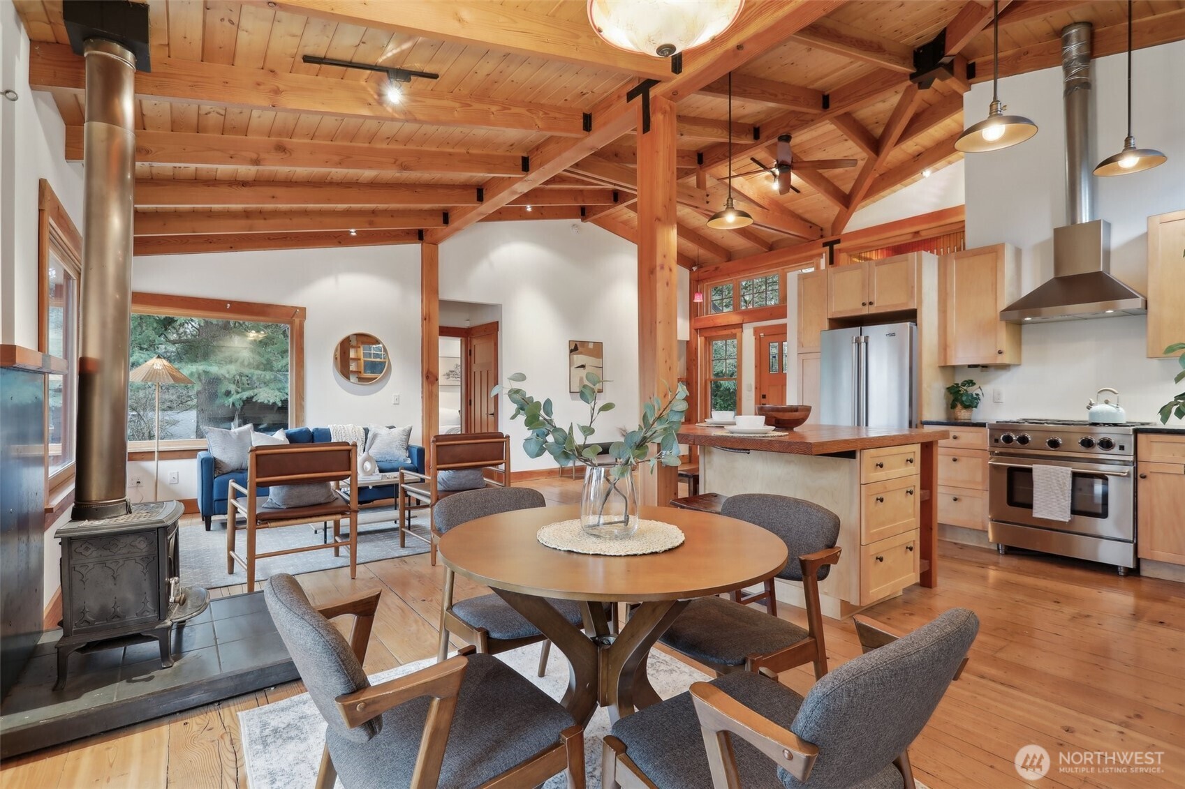 Living room seamlessly connects to the dining and kitchen space.