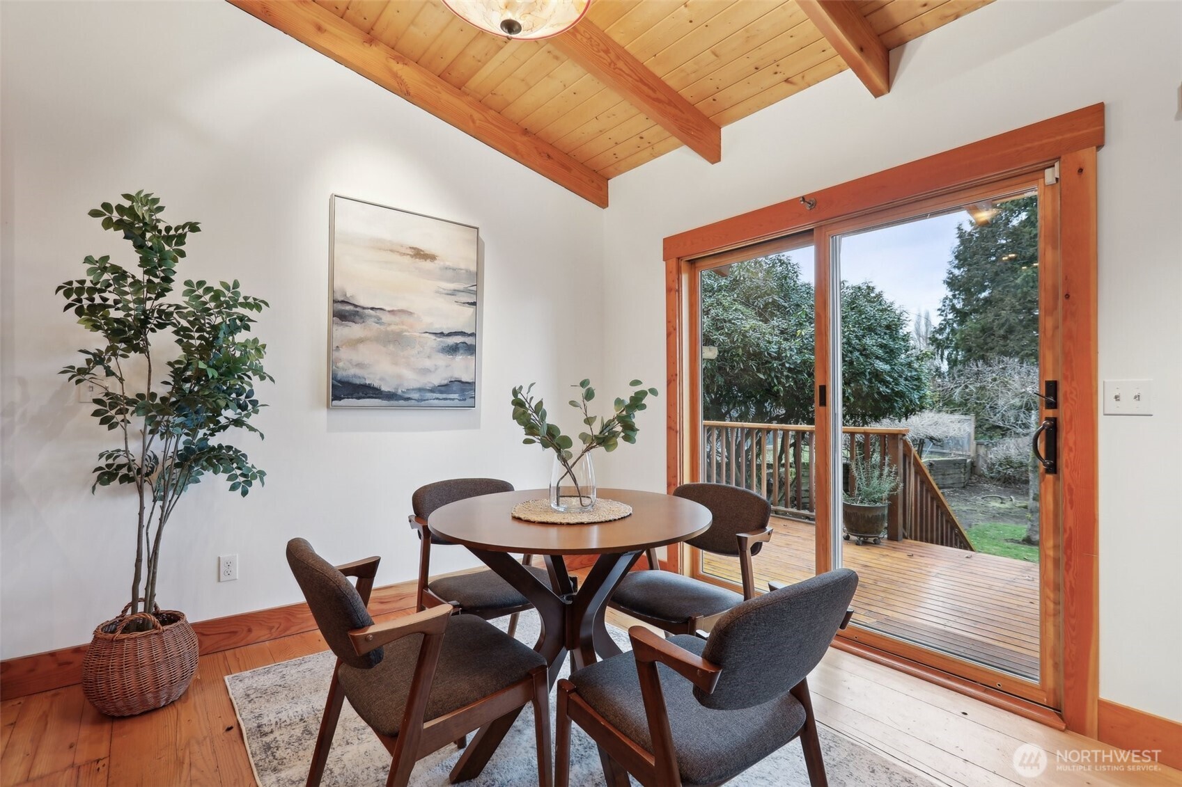 Slider from the dining area connects you to the large deck and north view of the backyard.