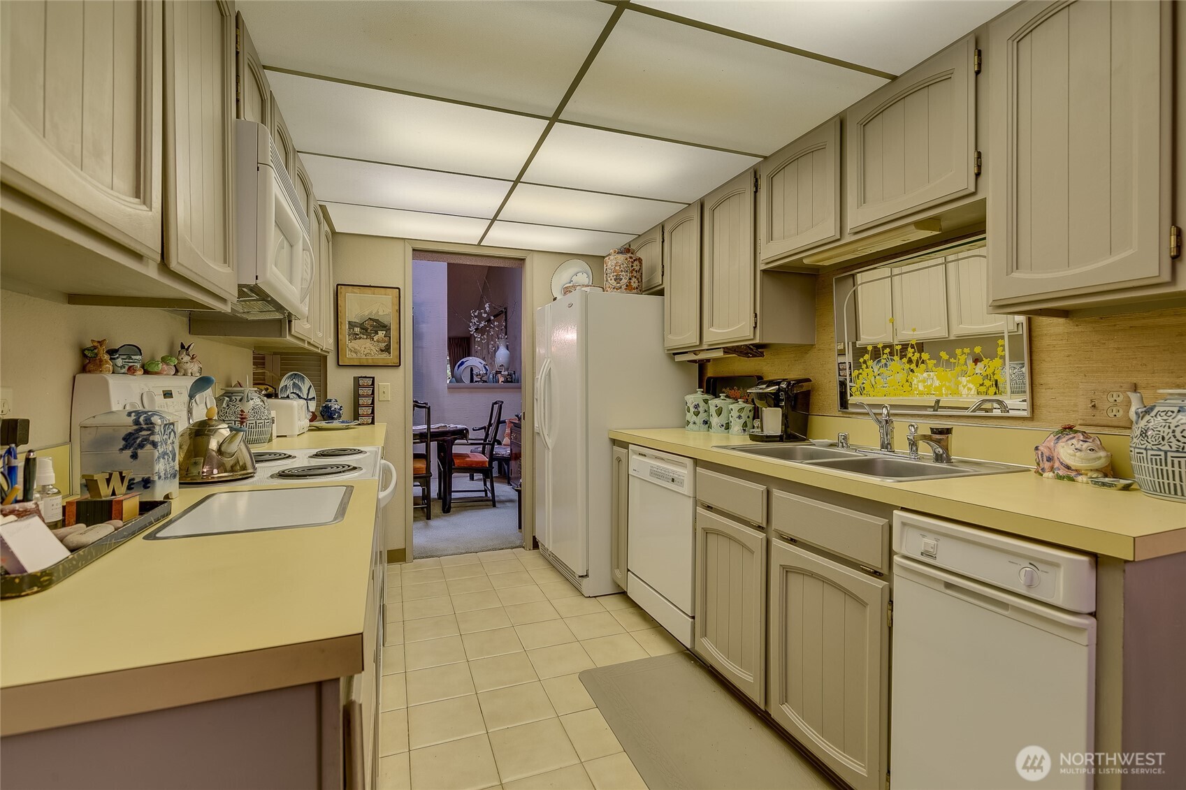 Kitchen opening to Dining room on far side.