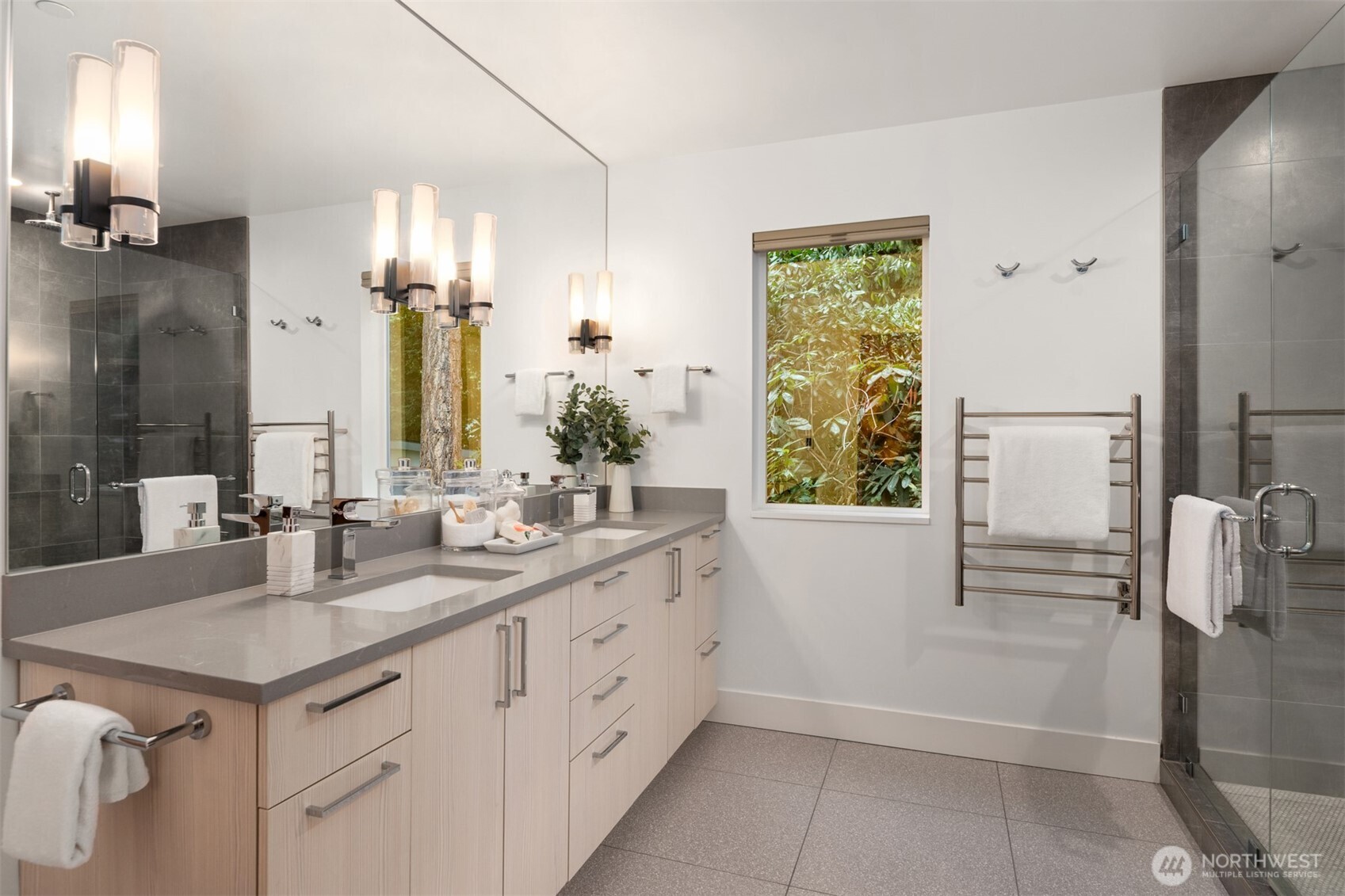 Spa like bathroom with  dual vanity and heated towel bar.  So nice for our wintery months!