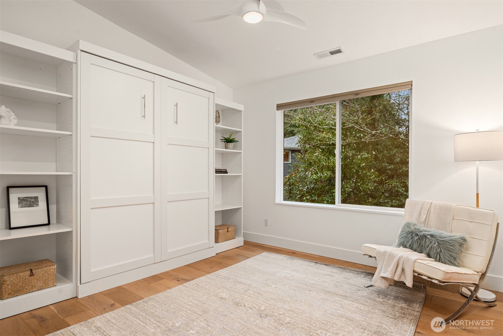 Bedroom with custom built-in Murphy bed provides great flexibility for guests or your choice!