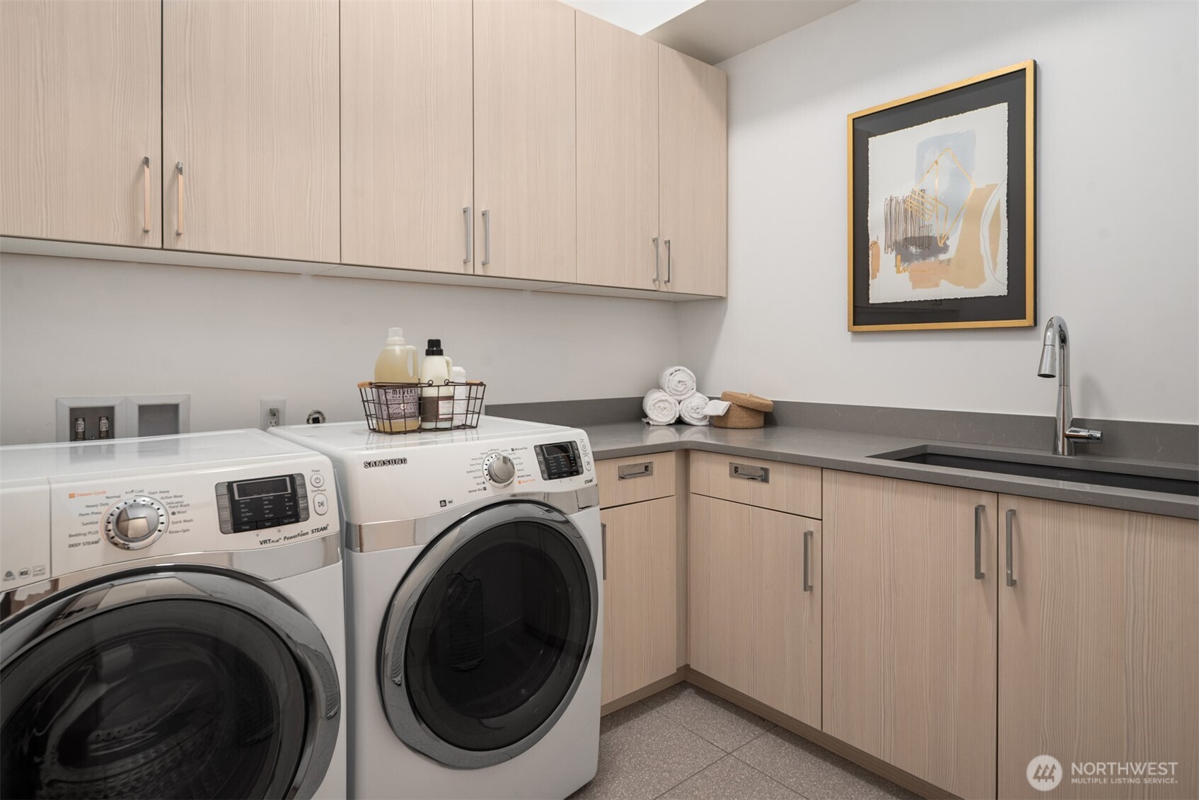 Upper floor spacious laundry room.