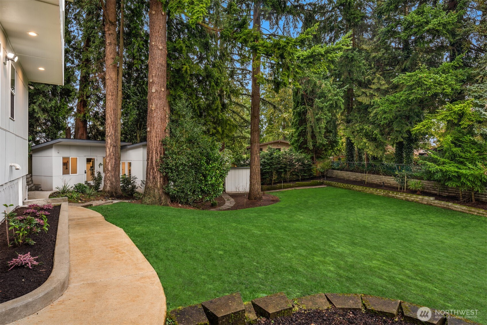 This is one of Kirkland’s best private backyards. Ready for soccer, football, morning  yoga or evening star gazing!