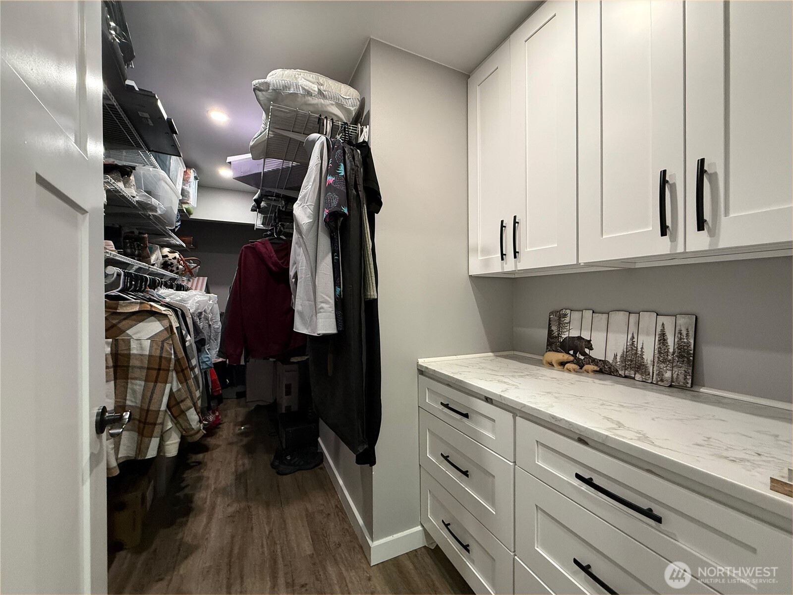 Extra large primary closet with custom build out.