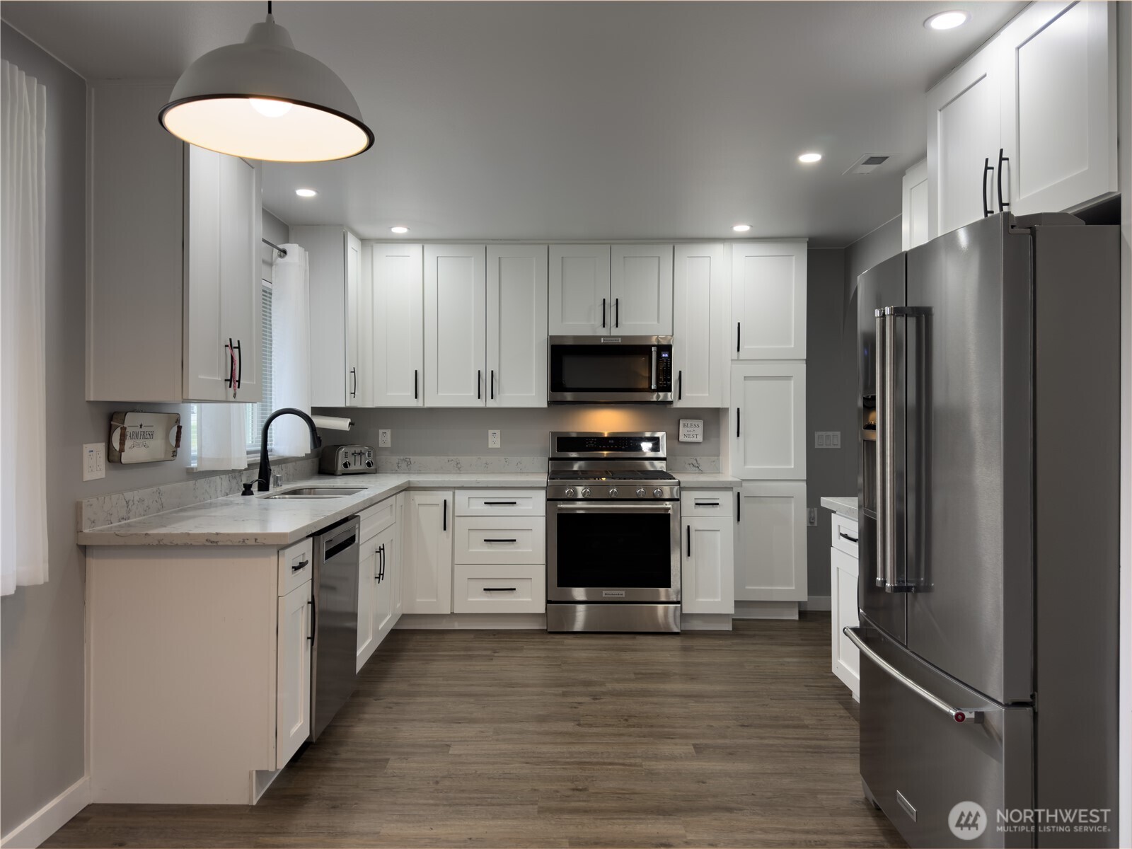 Bright open kitchen with quartz counters