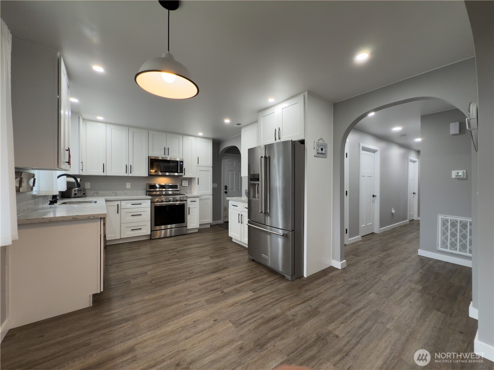 Bright open kitchen with quartz counters