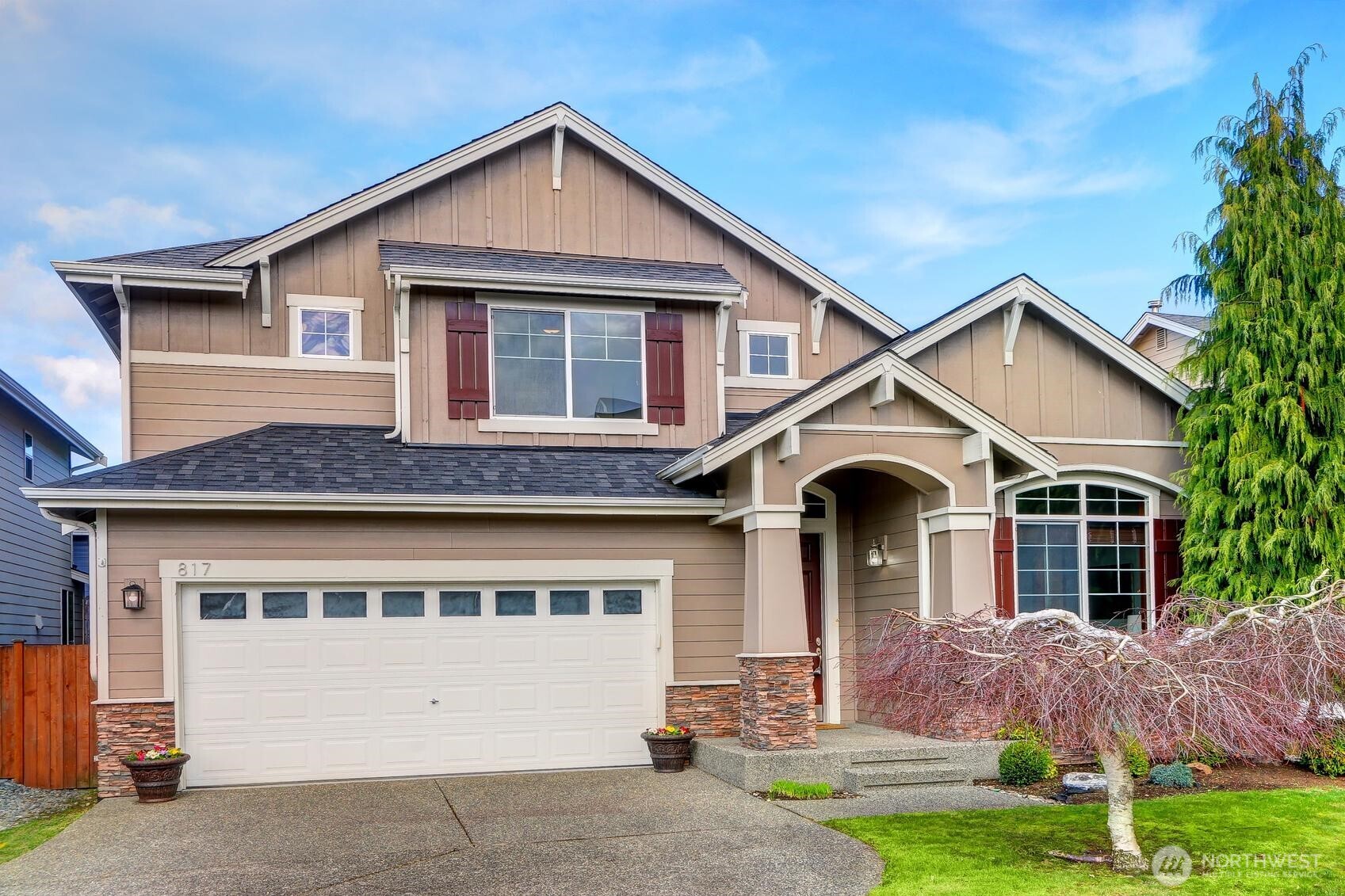 Flat driveway with a spacious two-car garage.