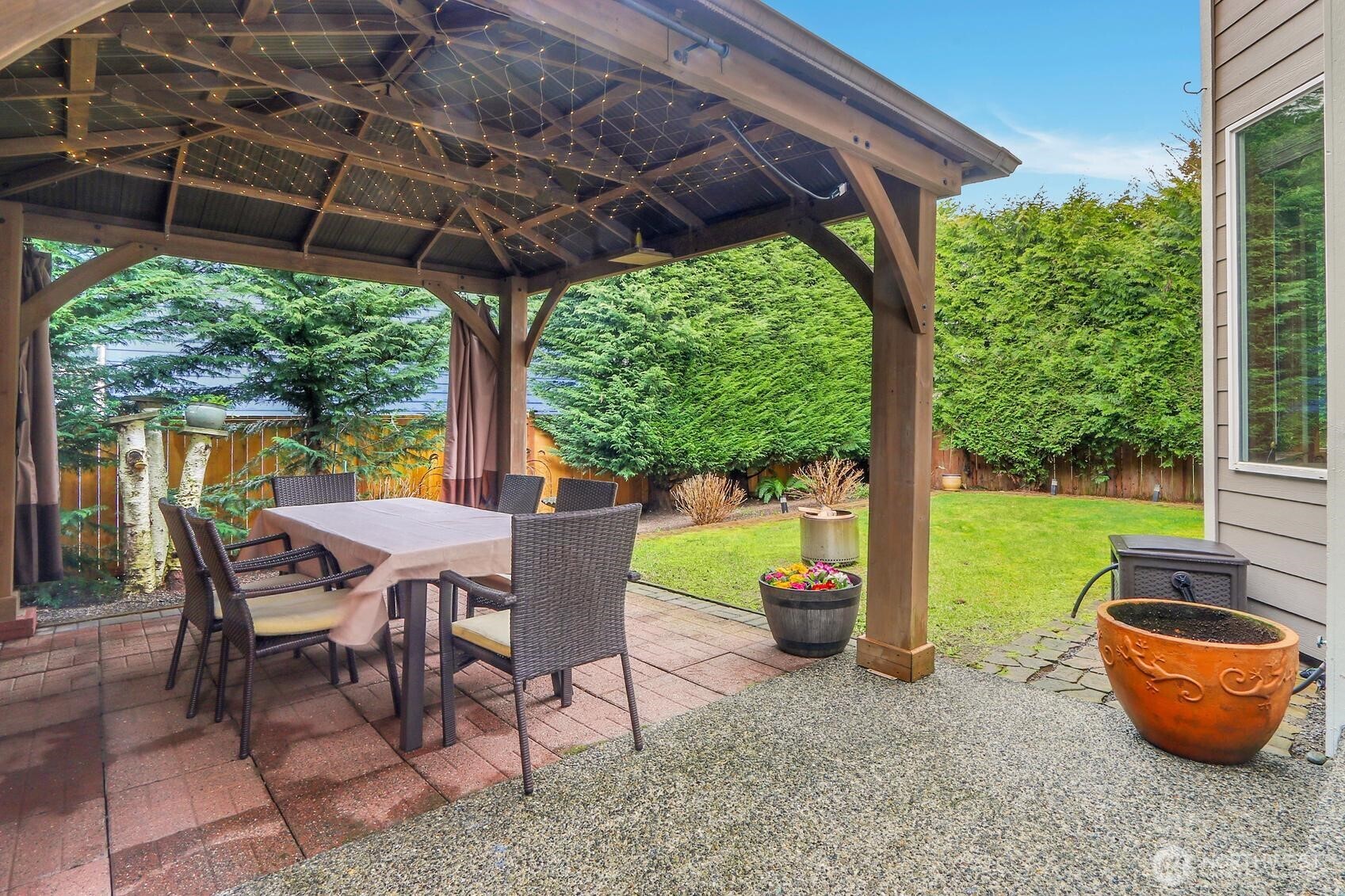 Backyard gazebo and patio create the perfect space for BBQs and entertaining!