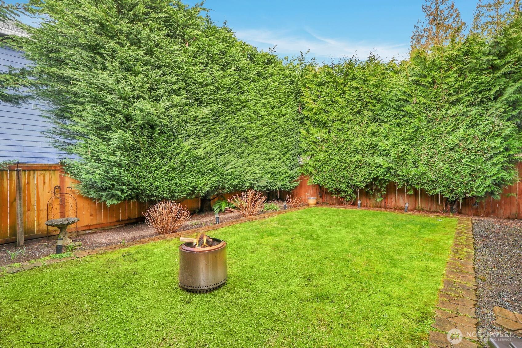 Fully fenced backyard offers privacy.