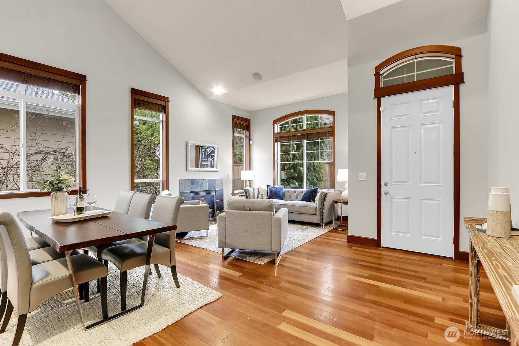 Formal dining area adjacent to the bright living room.