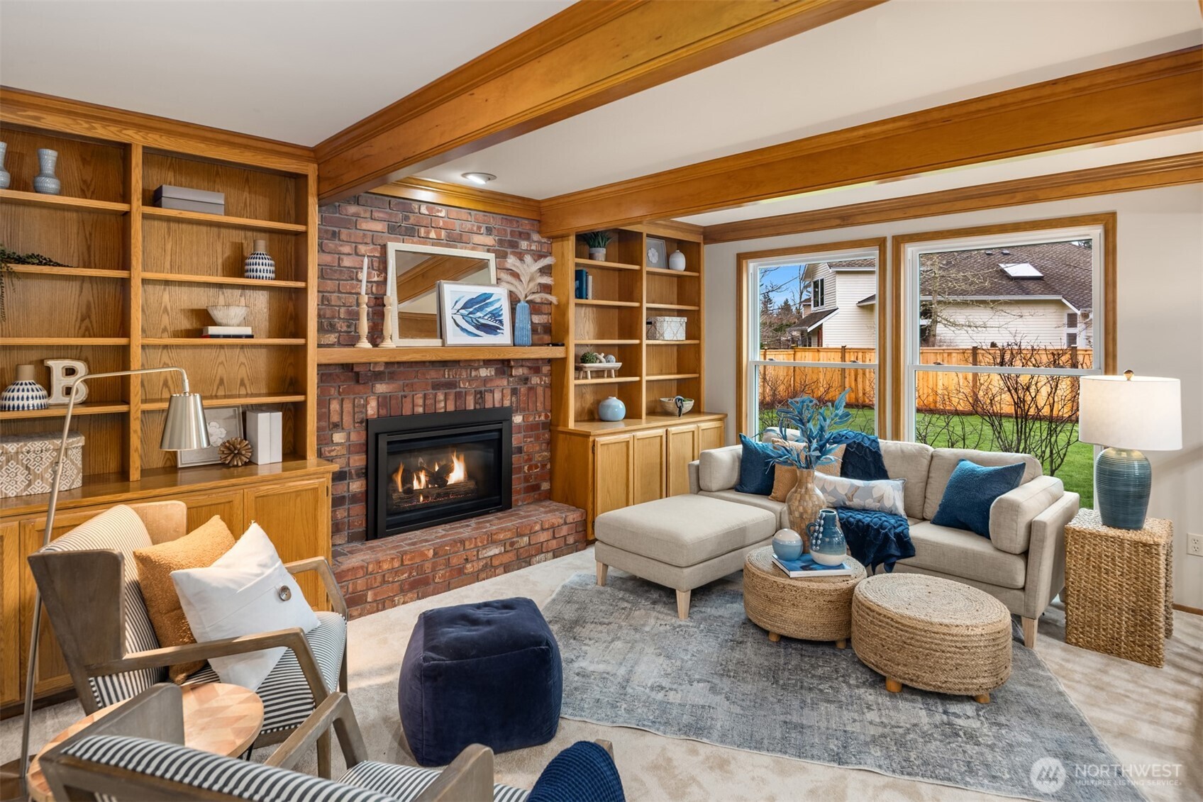 Step into the sunken family room with beautiful beamed ceiling