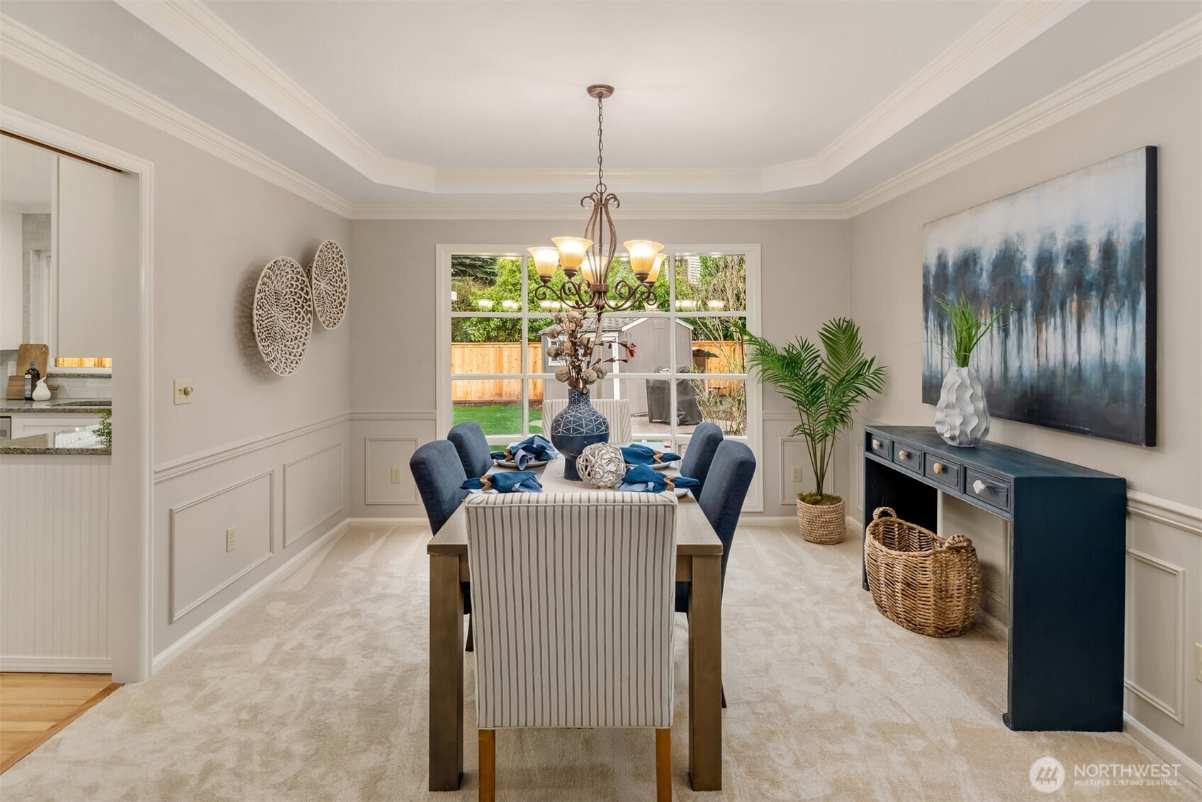 The tray ceiling adds to the elegant look of the dining room