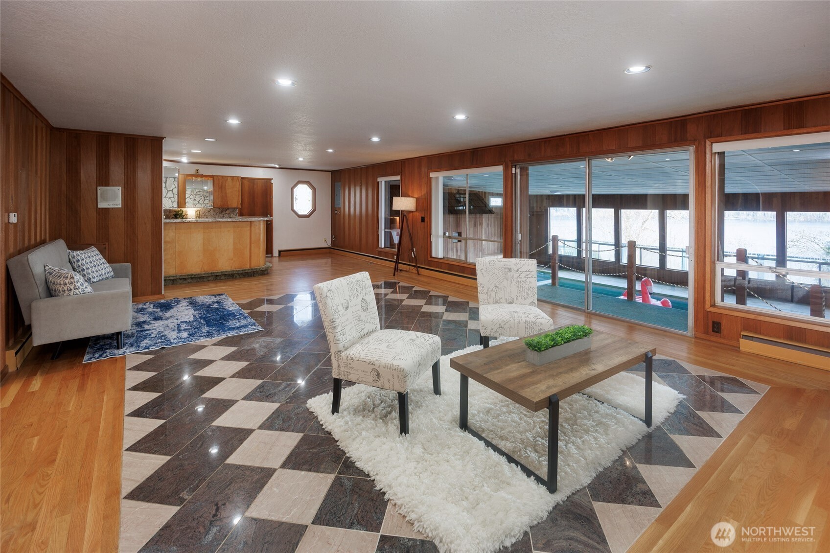 Entertainment sized recreation room offers a fireplace, bar & access to the indoor pool.