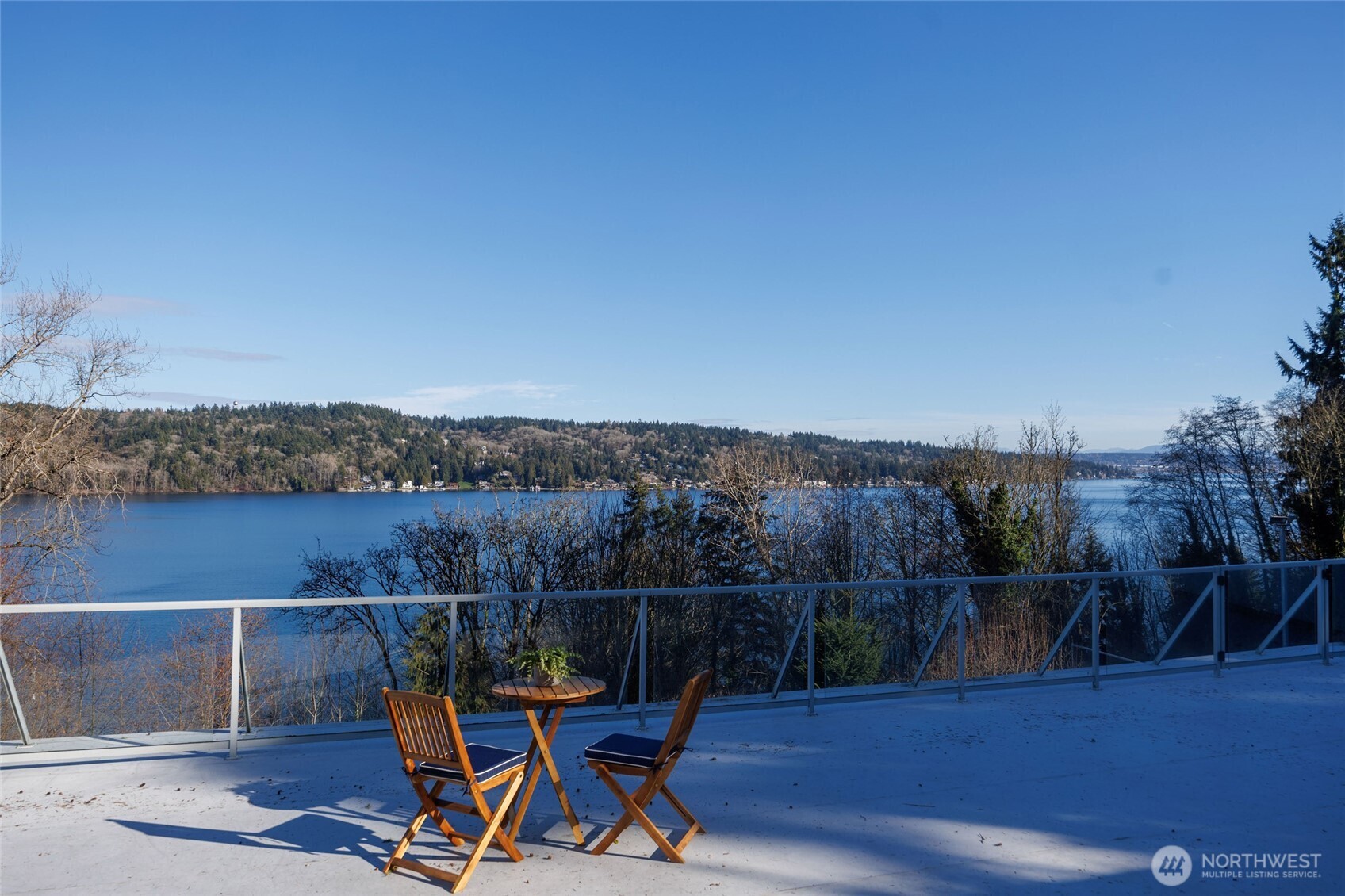 This sanctuary offers an elevated lifestyle with panoramic lake & mountain views.