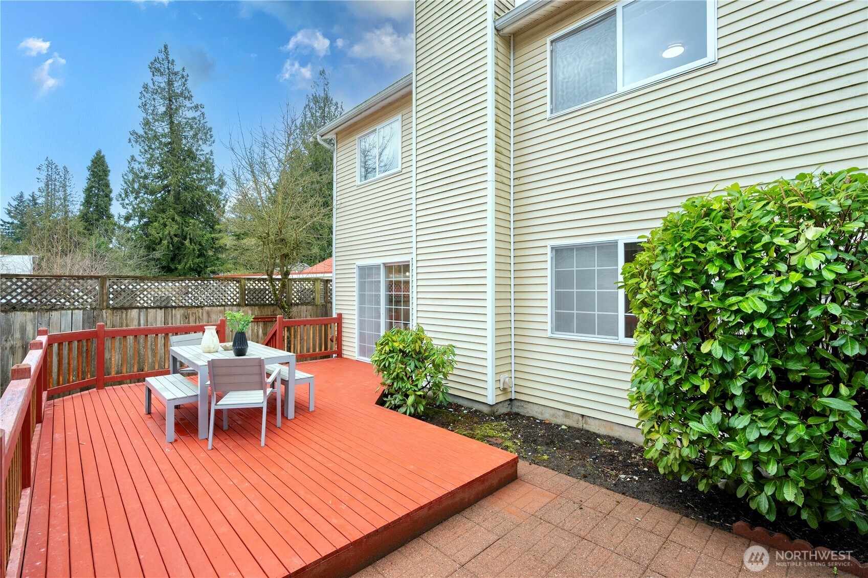 Huge backyard with concrete and deck!