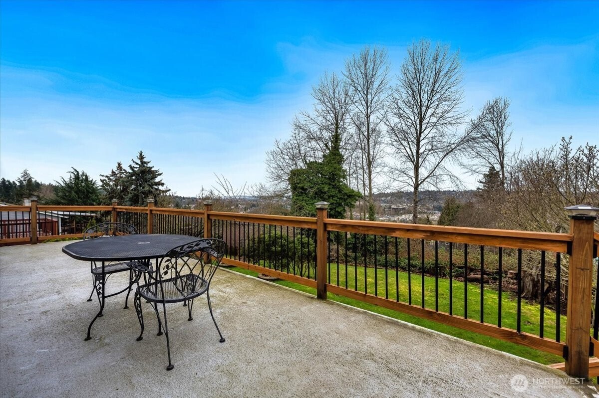 Huge entertainment sized deck overlooking the large lot and beautiful city views.