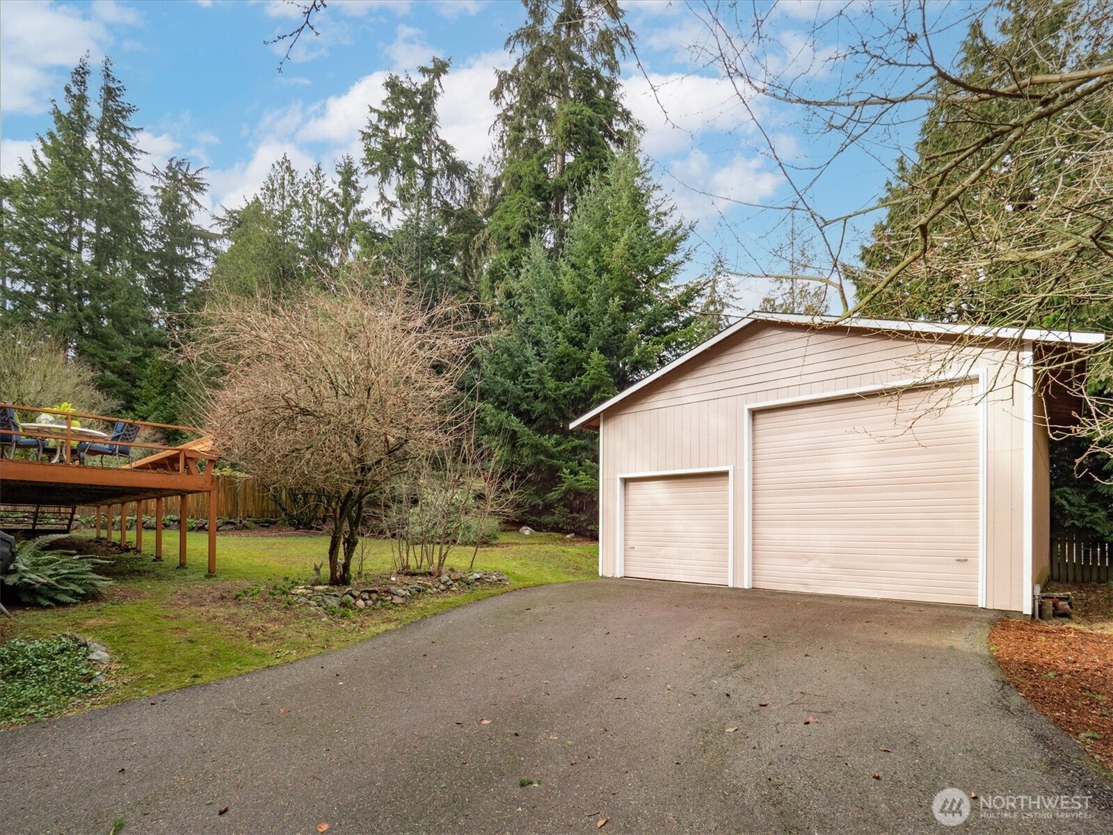 Built in 1993 26'x30' New roof in 2004. 8' door and 12' door and RV dump outlet next to garage.