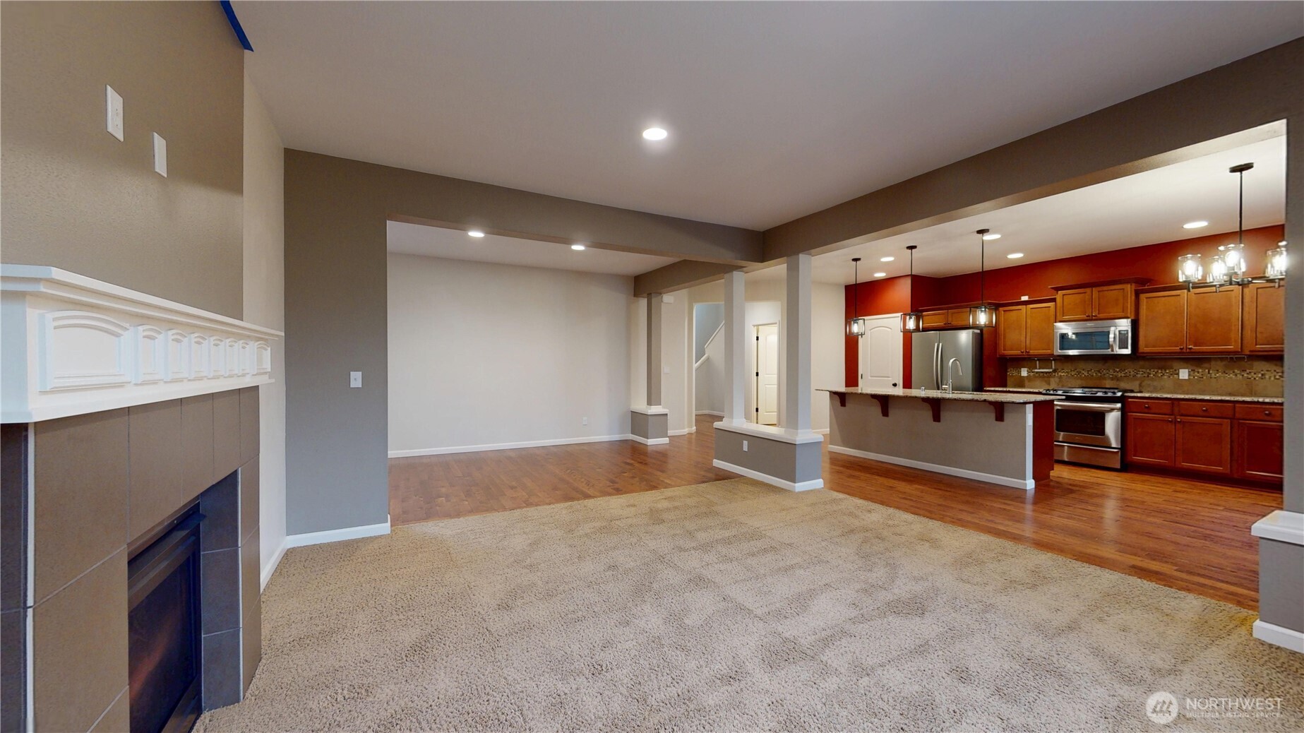 living room adjacent to kitchen and formal dinning