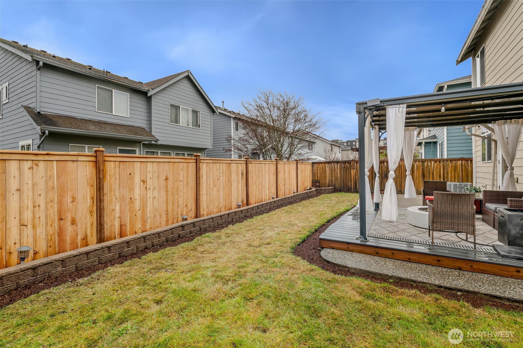 Well sized lawn is easy to maintain and the security fence offers privacy