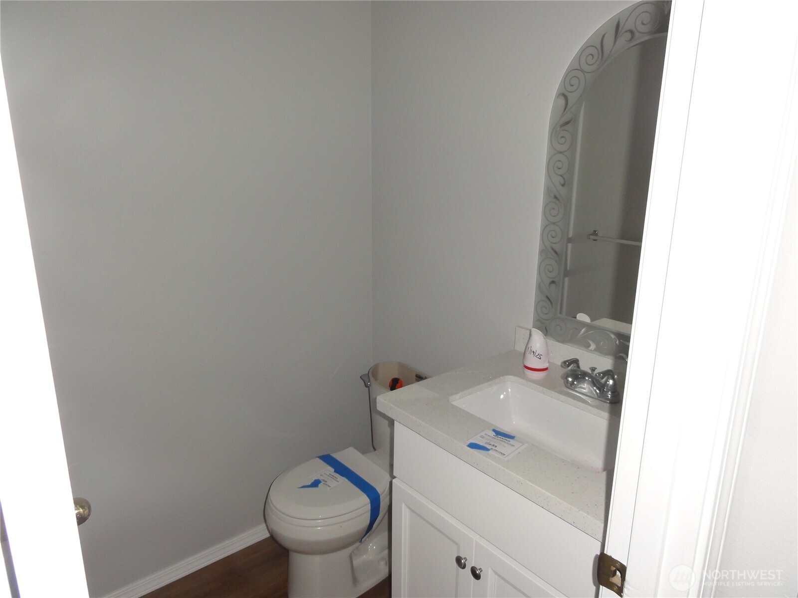 Powder bath off family room.