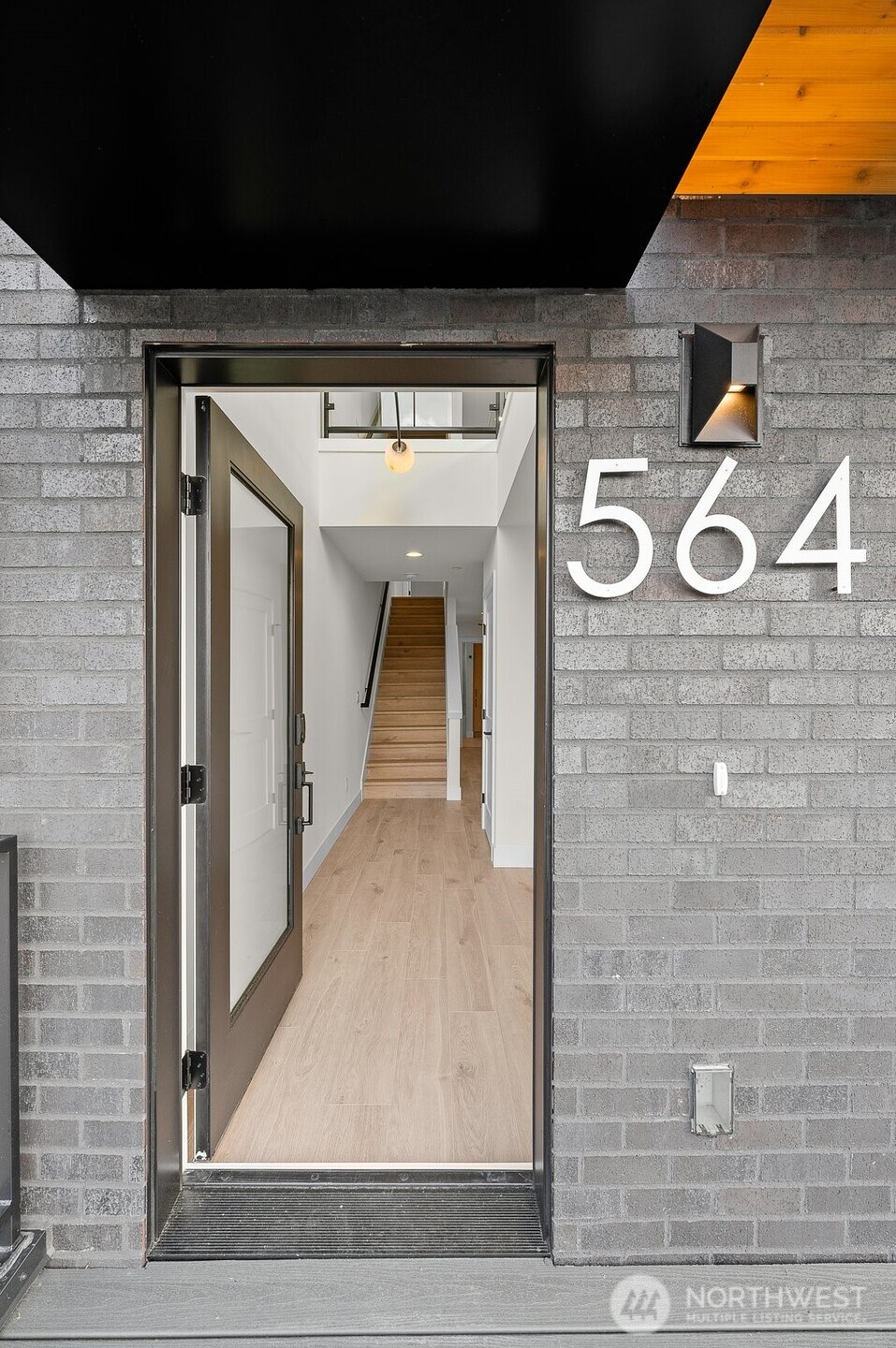 Step into the vaulted mudroom with built-in storage.