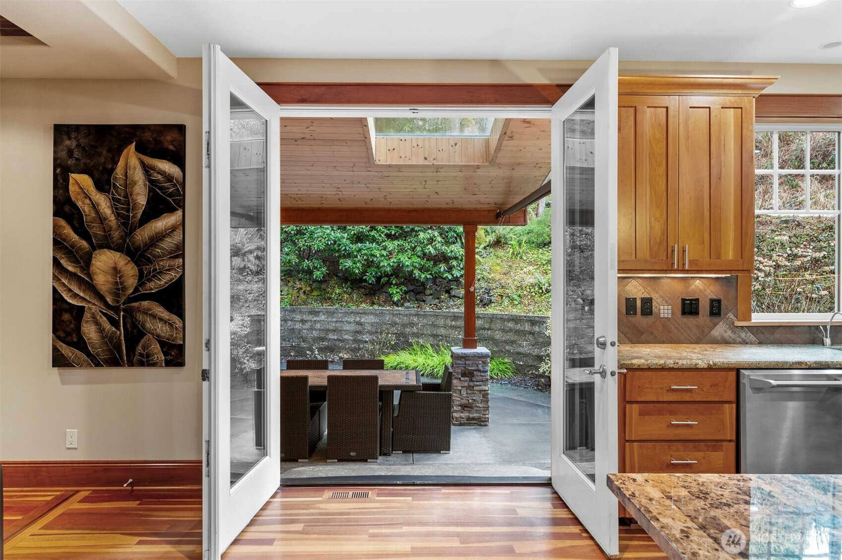Tranquil covered patio right off the kitchen, perfect for PNW outdoor living.