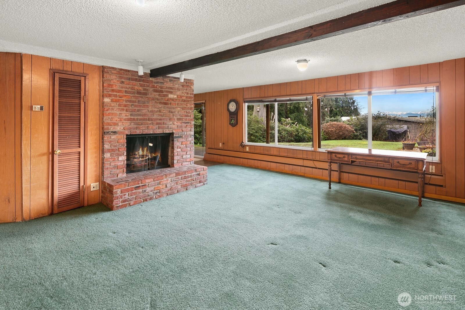 Head downstairs to discover even more space, including this large rec room with a second fireplace. Keep it as it is or....