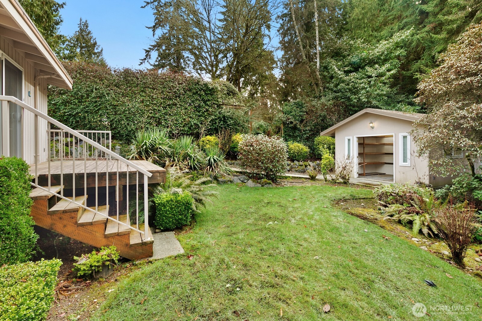 Head down the stairs to explore your peaceful, private setting - and don't miss the awesome detached shed!