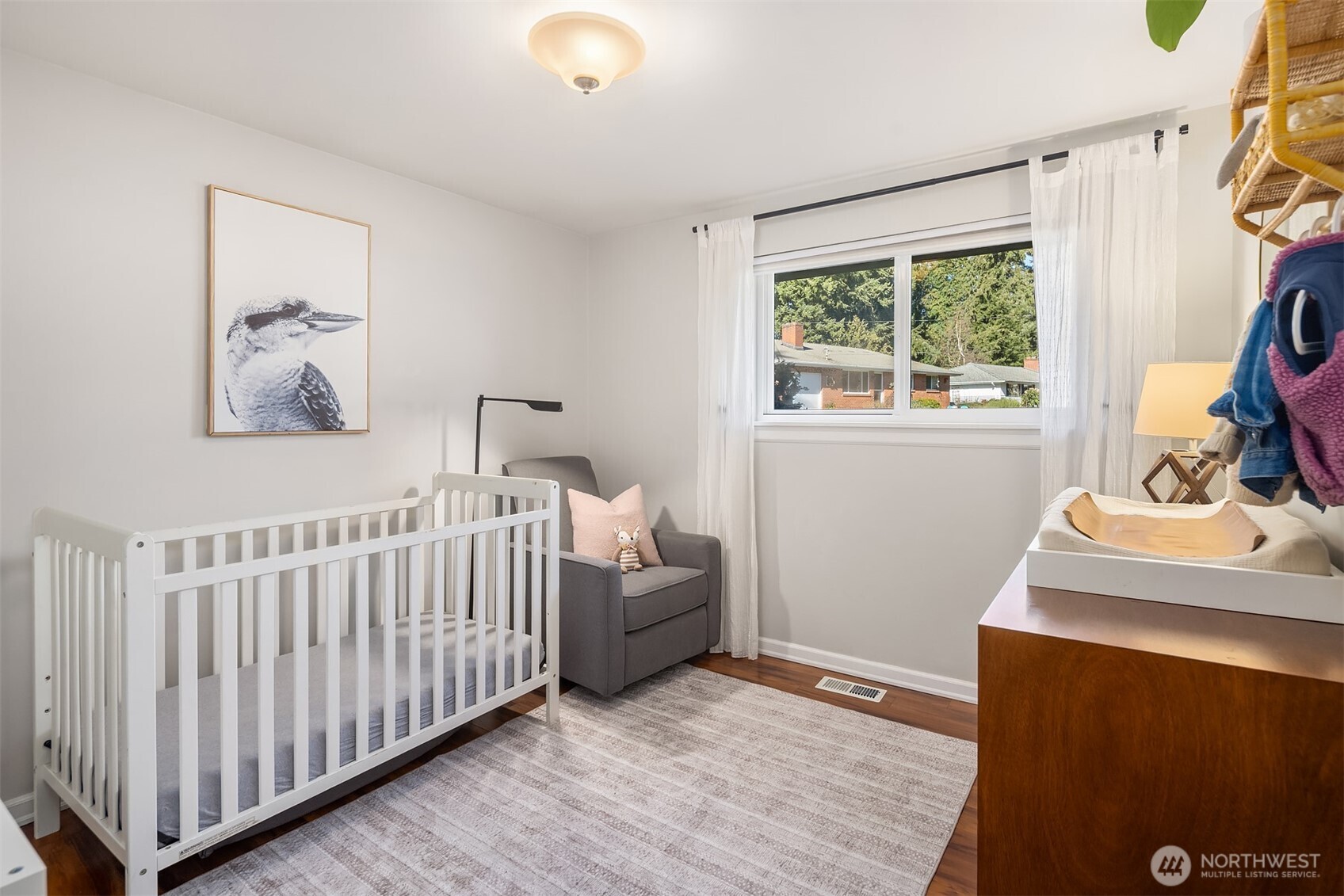 Bedroom with ample natural light and comfortable layout.